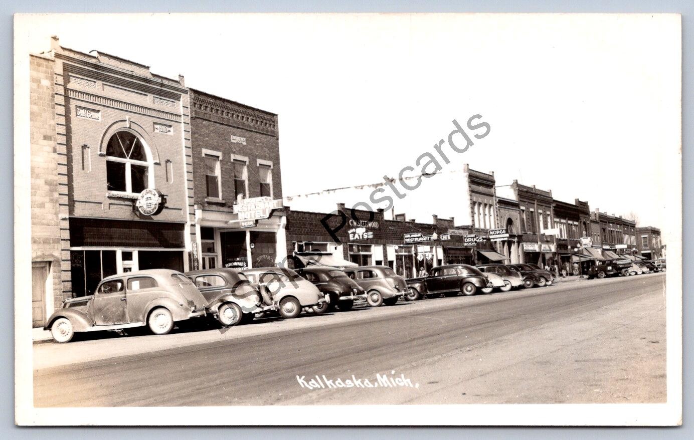 K65/ Kalkaska Michigan RPPC Postcard c1950s Main Street Stores Autos 111 K65/ Kalkaska Michigan RPPC Postcard c1950s Main Street Stores Autos 111