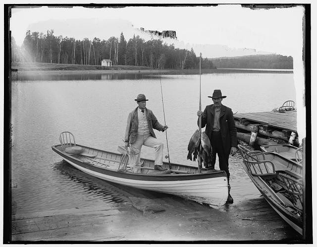 Black bass fishing,canoes,boats,docks,pier,Lake Gogebic,Michigan,MI,1880