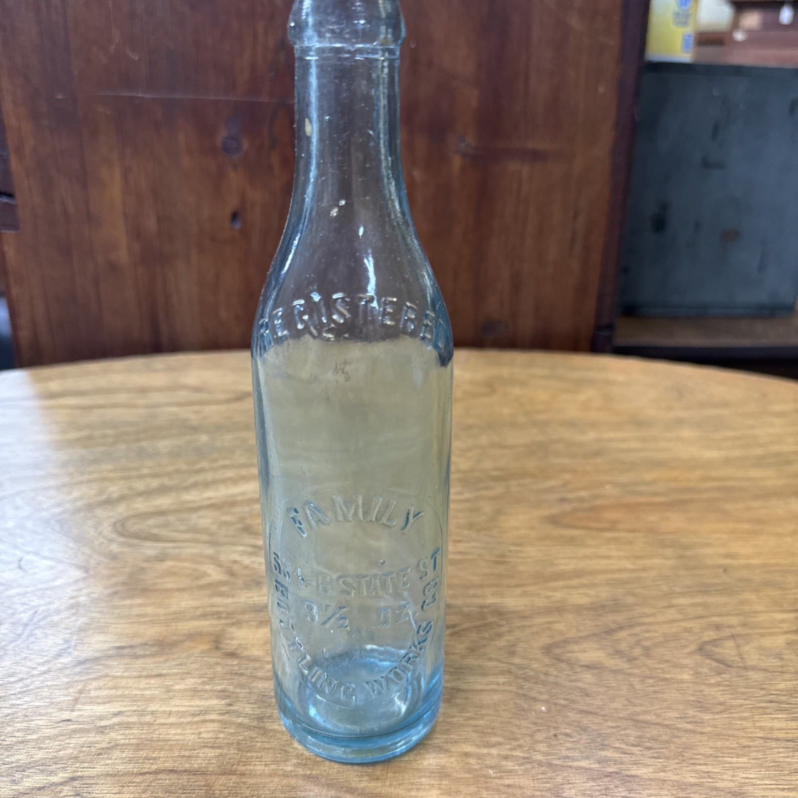 Vintage Family Bottling Wks.  Rochester, NY 9 1/2 Oz Embossed Bottle State St