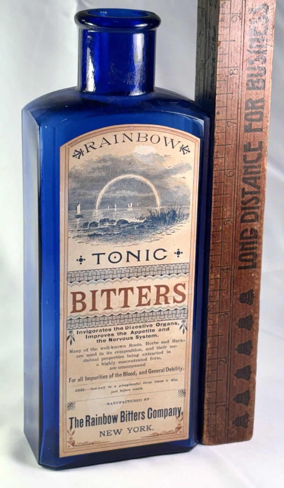 VTG RAINBOW TONIC BITTERS COMPANY PAPER LABEL ON COBALT MEDICINE 1880S BOTTLE US