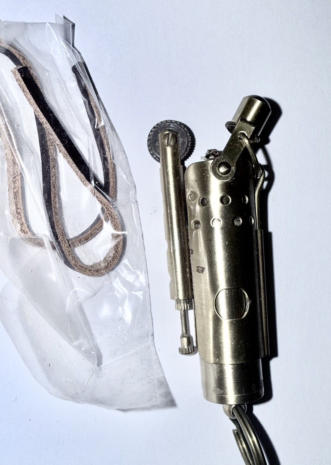  Models brass “trench  keychain lighter, in Cape Horn Marin presentation box. 