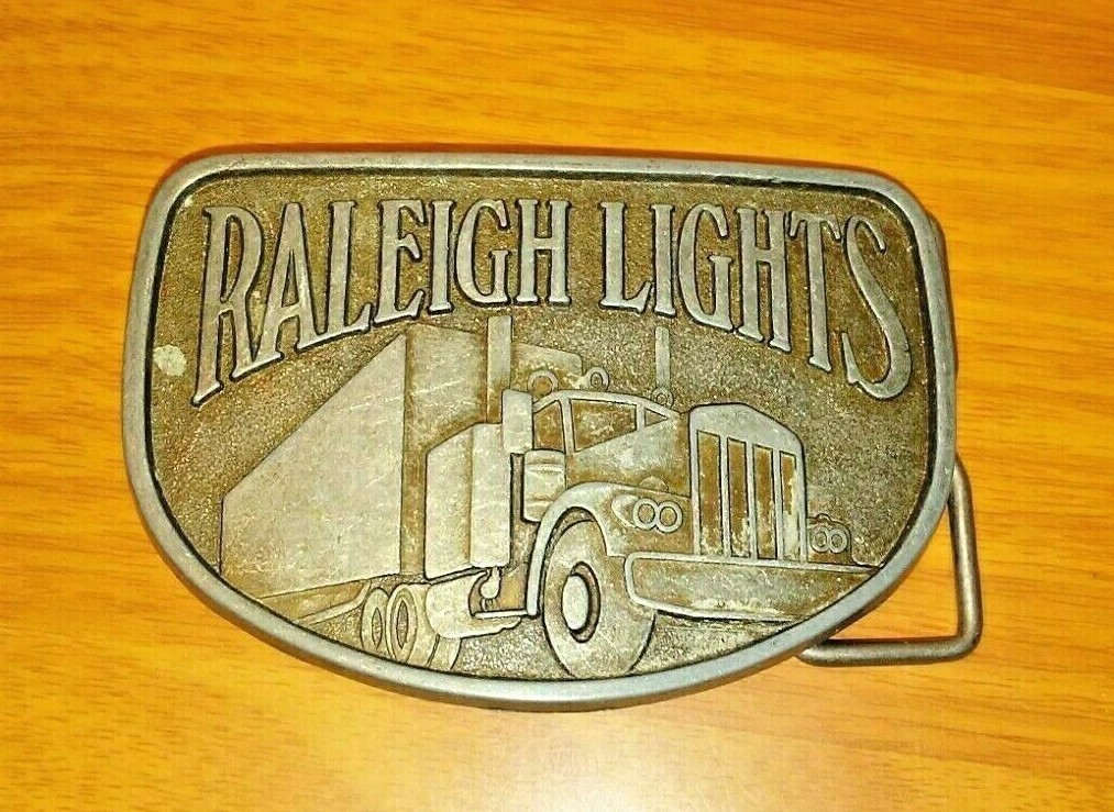 Raleigh Lights Trucker Belt Buckle Big Rig Semi Truck Vintage 1980s