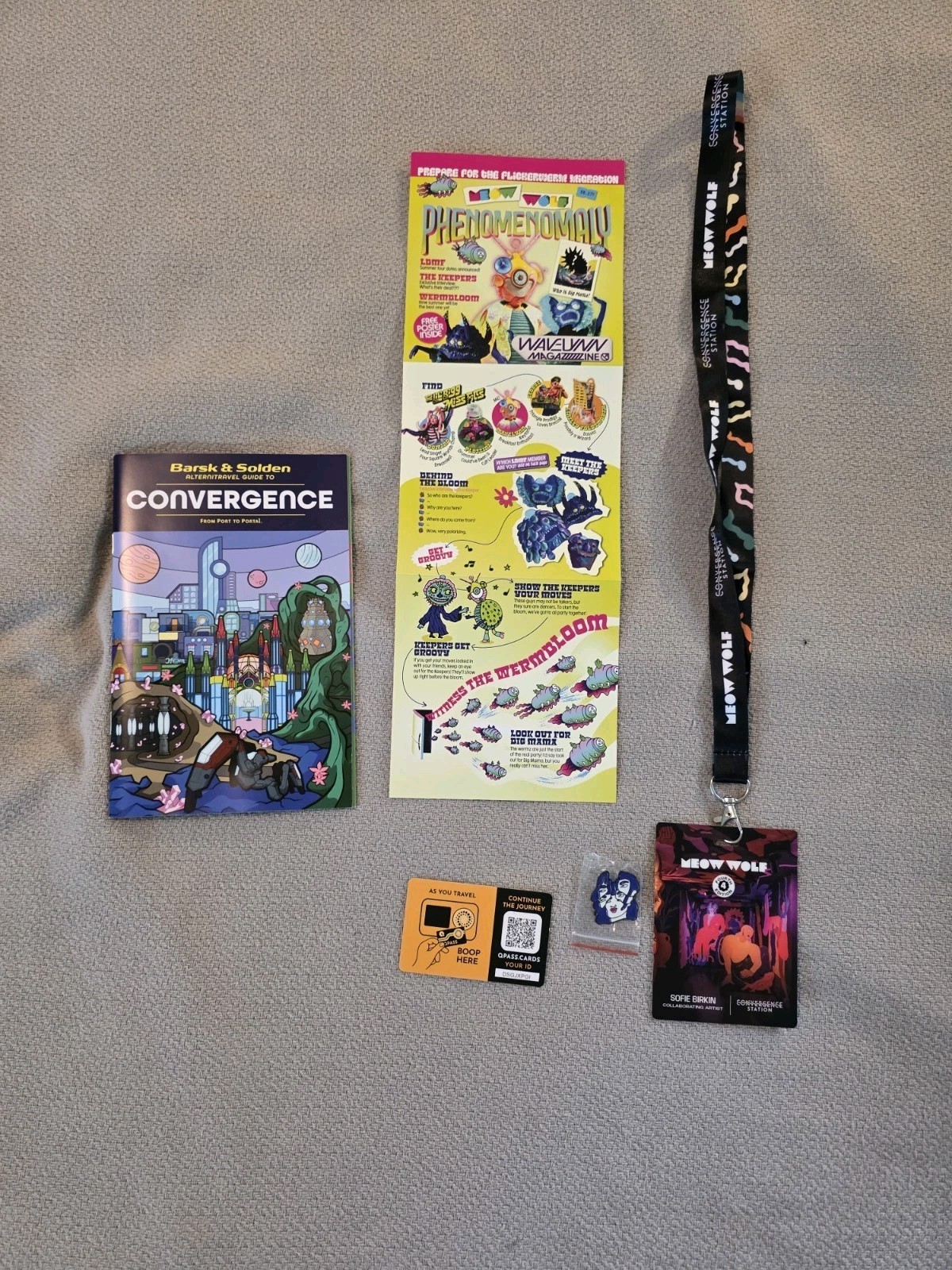 Meow Wolf Denver VIP (July 2026 Swag: Lanyard, Pin, Program Guide, & Mini Guide.