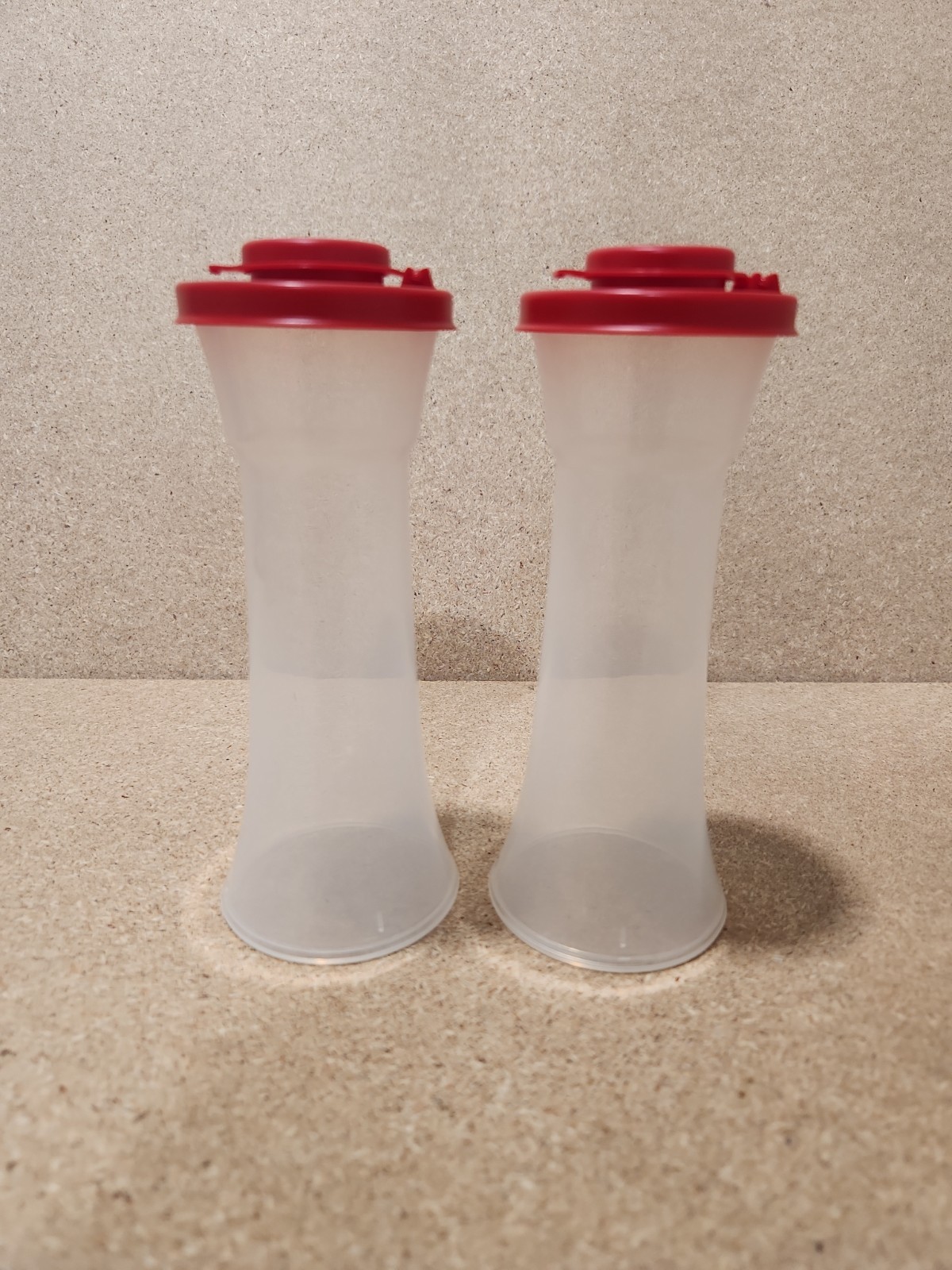 Tupperware Large Hourglass Salt and Pepper Shaker Set In Fiesta Red Brand New Tupperware Large Hourglass Salt and Pepper Shaker Set In Fiesta Red Brand New