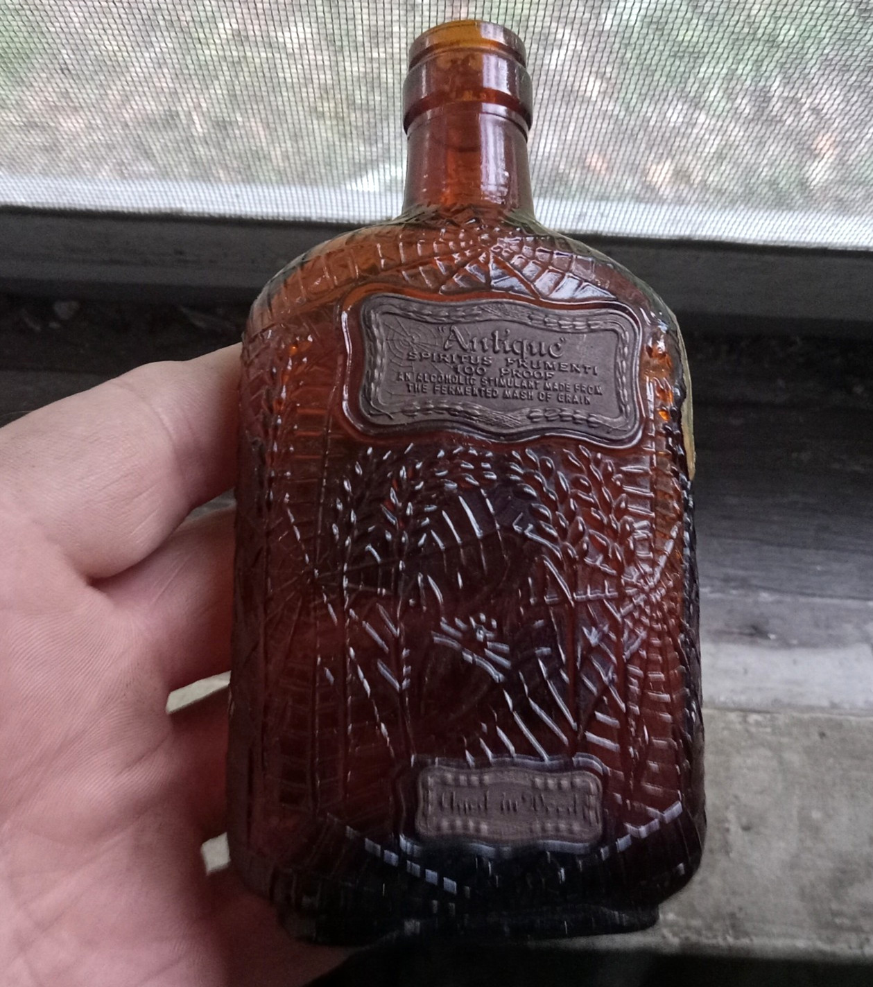 1915 DATED SPIRITUS FRUMENTI 1/4 PINT WHISKEY FLASK EMB SPIDER & FLY IN COBWEB