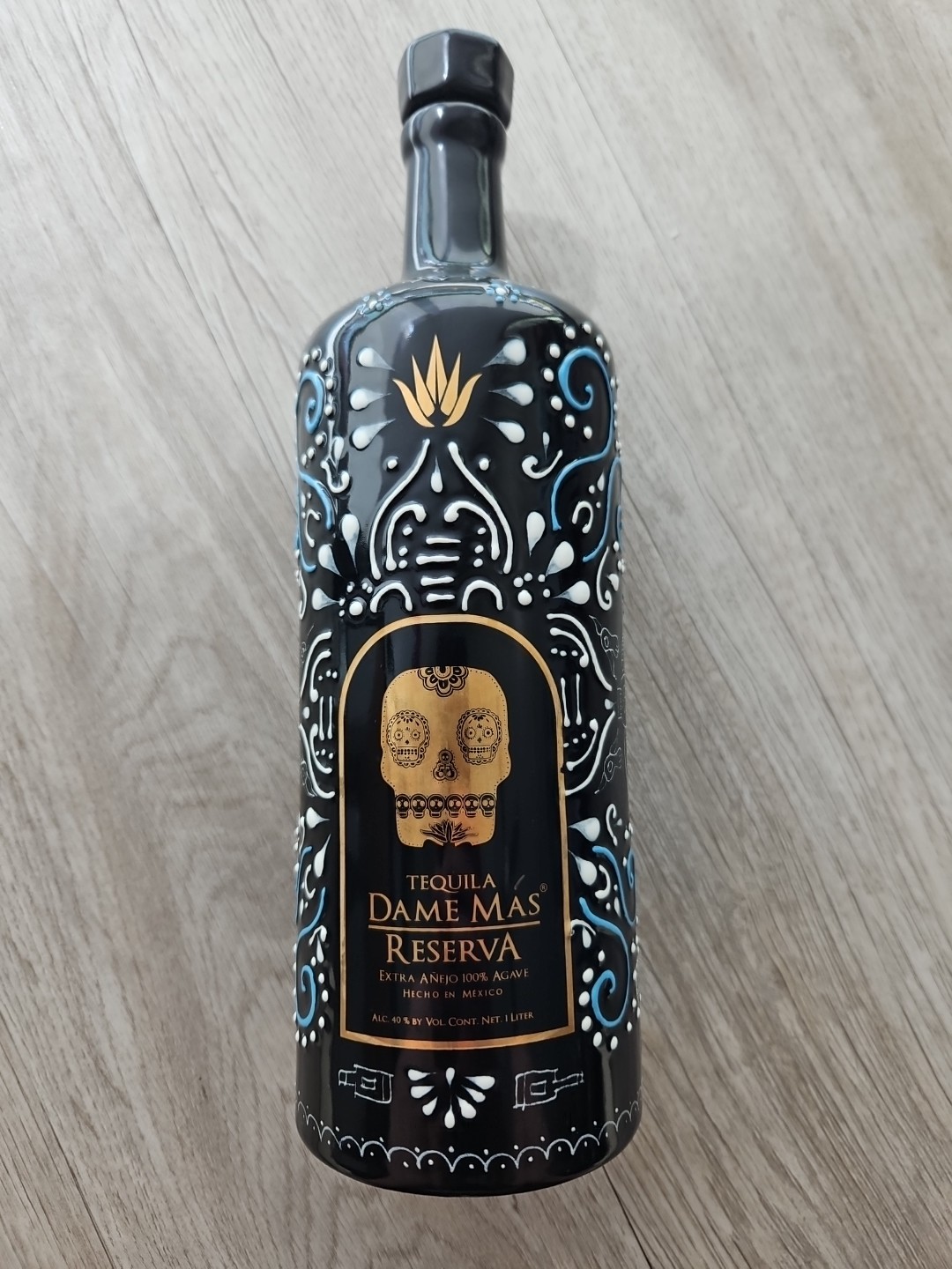 Dame Mas Reserva Tequilla Handmade 1 Liter, Black. Empty bottle with cork