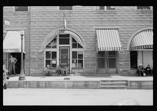 Photo:Clarksville Arkansas 1935 Street Scene Storefronts Insurance Sign