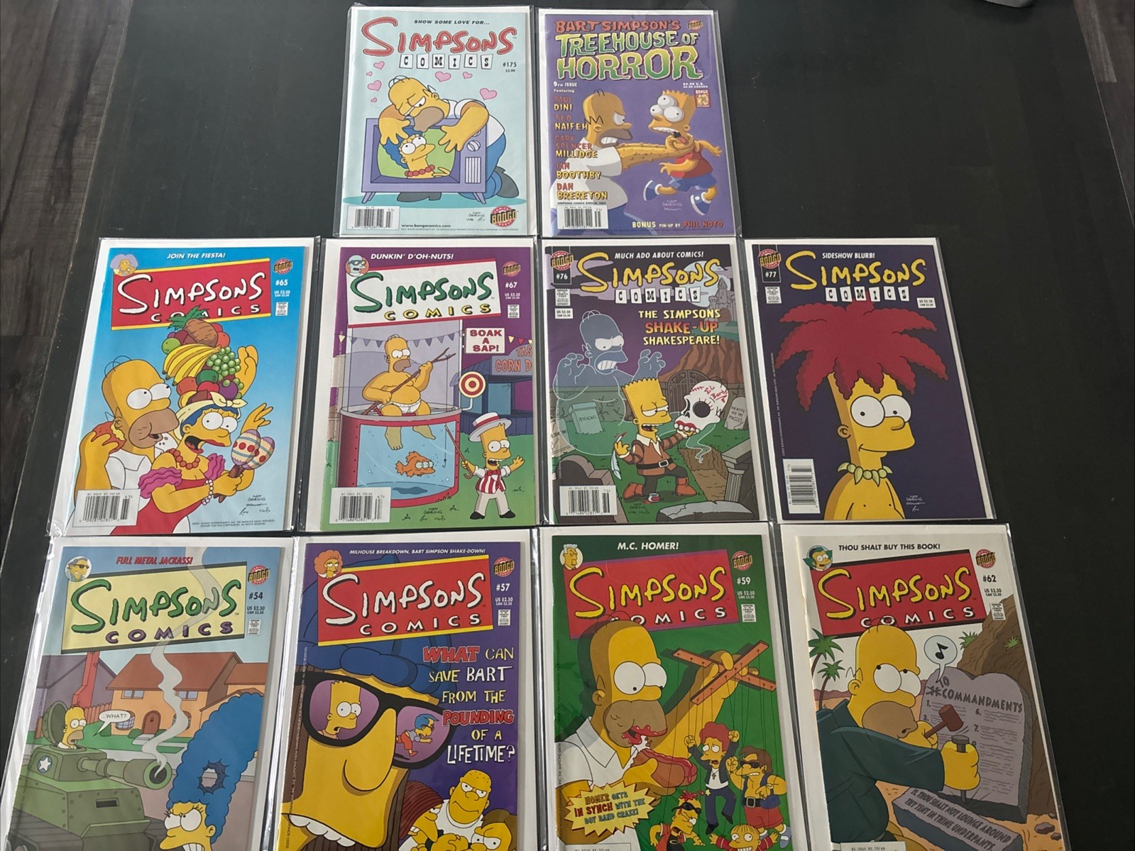 Lot (10) The Simpsons Comics Between #’s 54-175 (Bongo) FN-NM Treehouse Horror 9 Lot (10) The Simpsons Comics Between #’s 54-175 (Bongo) FN-NM Treehouse Horror 9