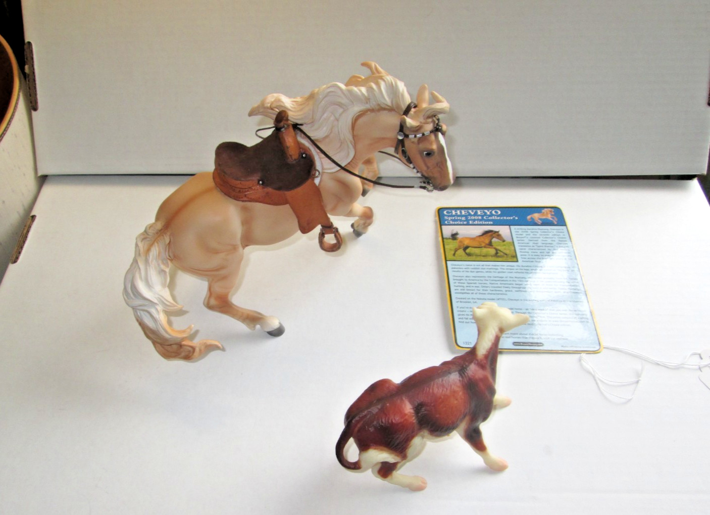 Breyer  Cheveyo, Nakota mold, with western tack and cutting calf 