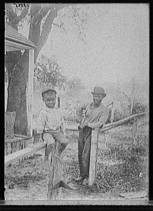 Photo:Little Eb Snow African American Boy Fence Portrait 1900s Detroit