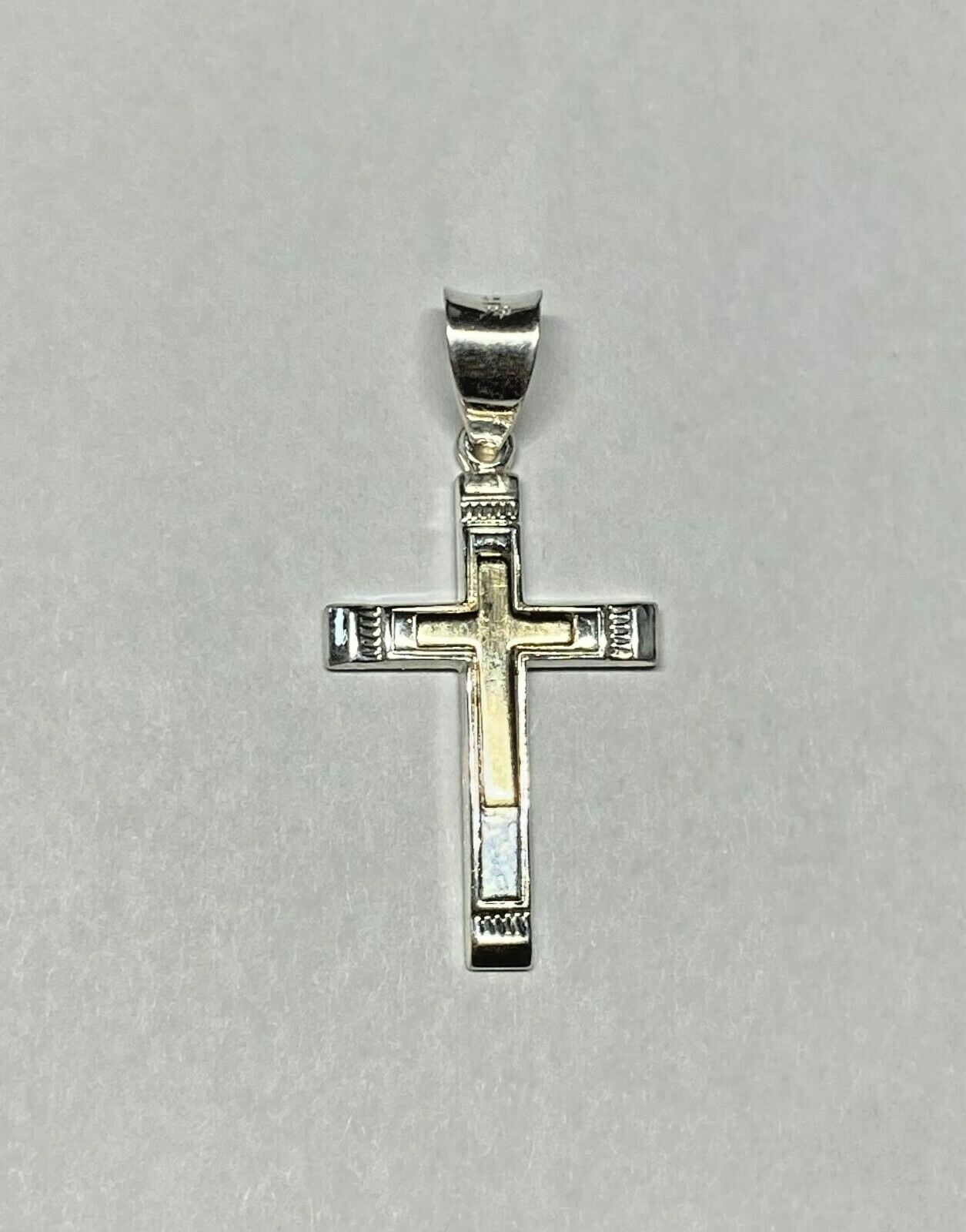 Sterling Silver & 14 Kt. Yellow Gold Cross Pendant (1.12\