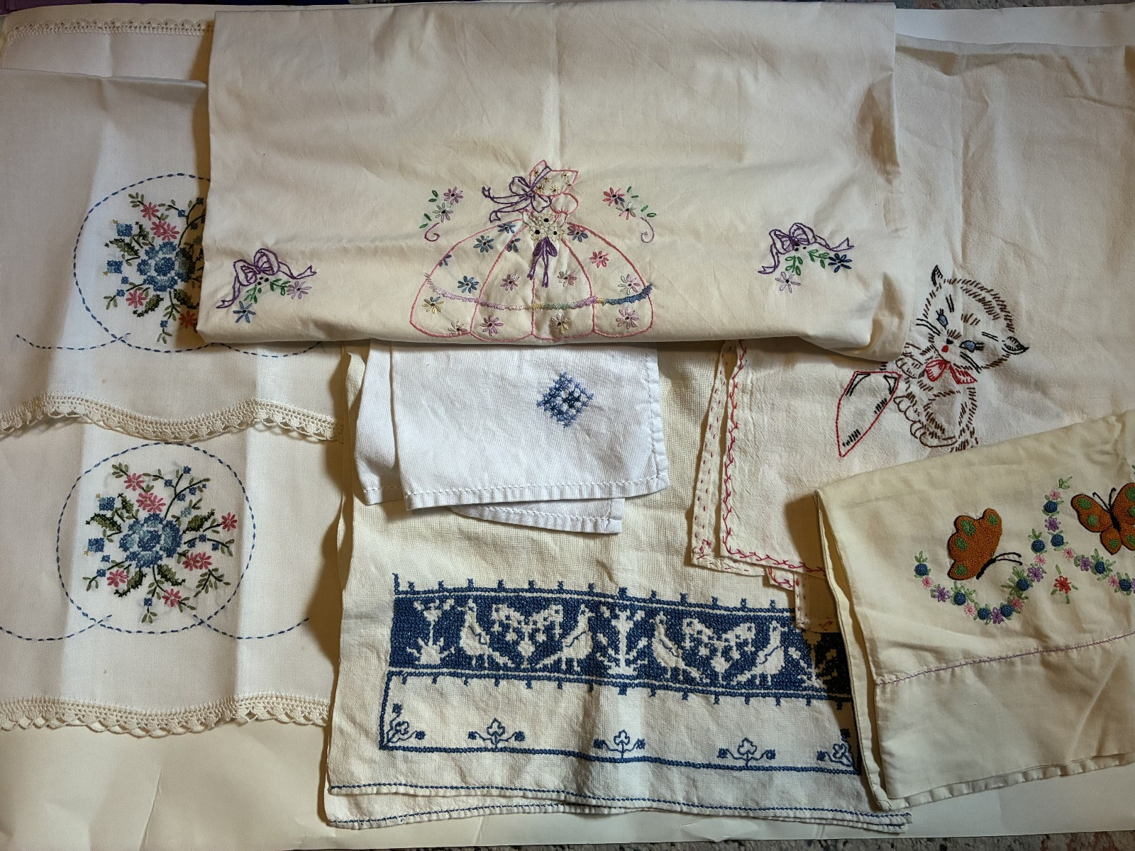 Lot of vintage hand embroidered linens napkins teatowels pillowcases