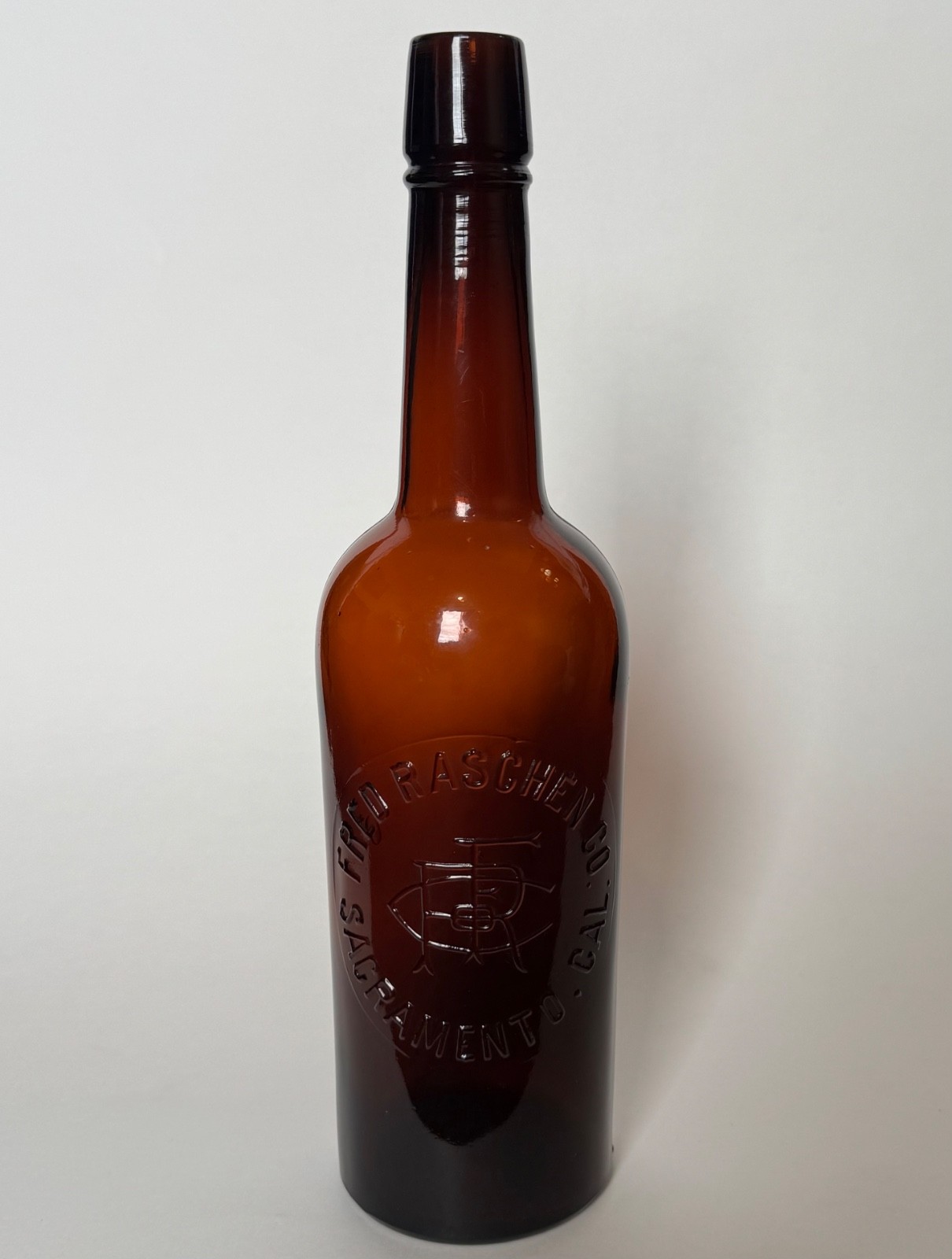 Nice Amber Fred Raschner Sacramento, Cal California cylinder whiskey bottle