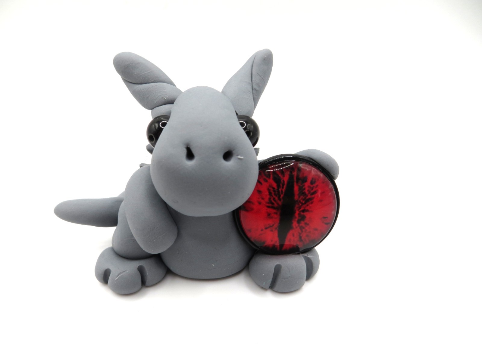 Gray dragon with a large red eye
