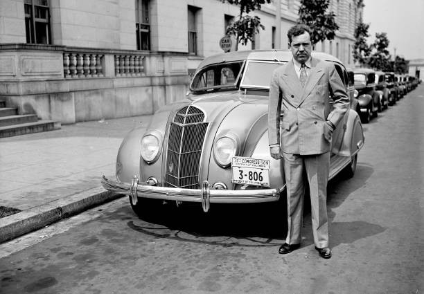 Senator Huey P Long standing by an automobile ca 1935 Historic Old Photo