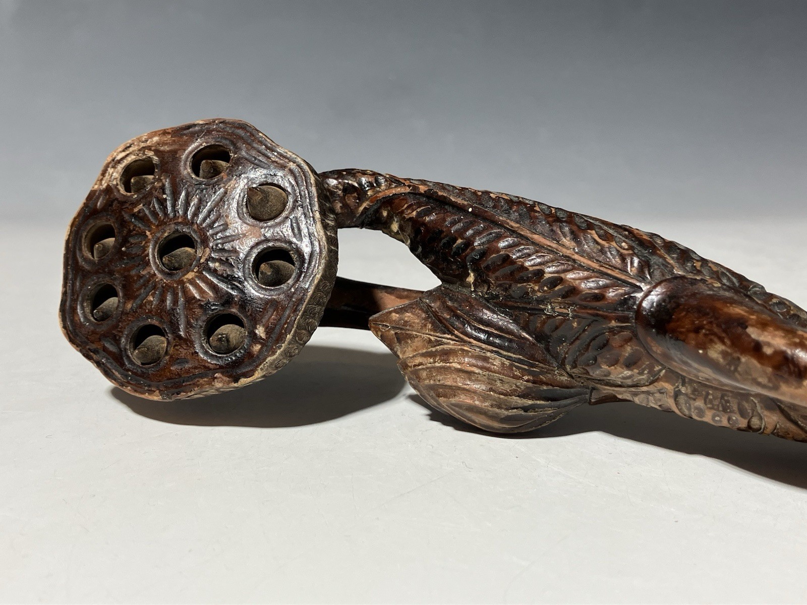 Antique Buddhist scepter, lotus bud and leaf