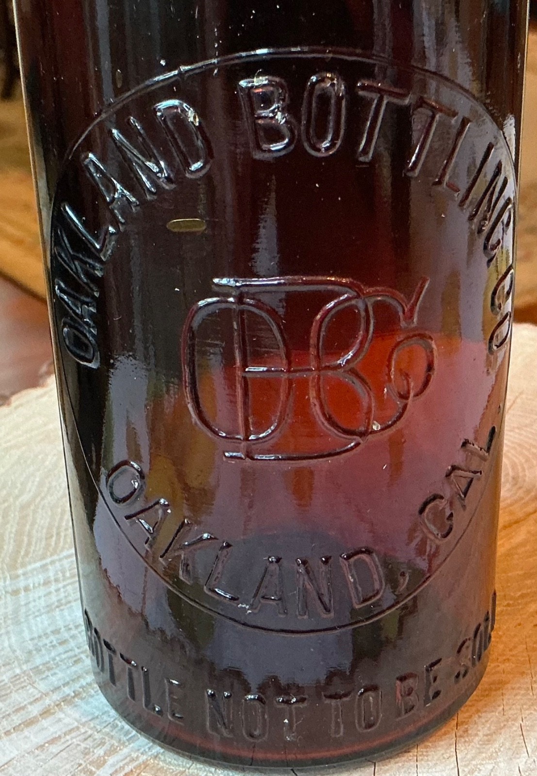 ANTIQUE OAKLAND BOTTLING CO. OAKLAND, CAL. BLOB TOP BEER, MONOGRAM IN SLUG PLATE ANTIQUE OAKLAND BOTTLING CO. OAKLAND, CAL. BLOB TOP BEER, MONOGRAM IN SLUG PLATE