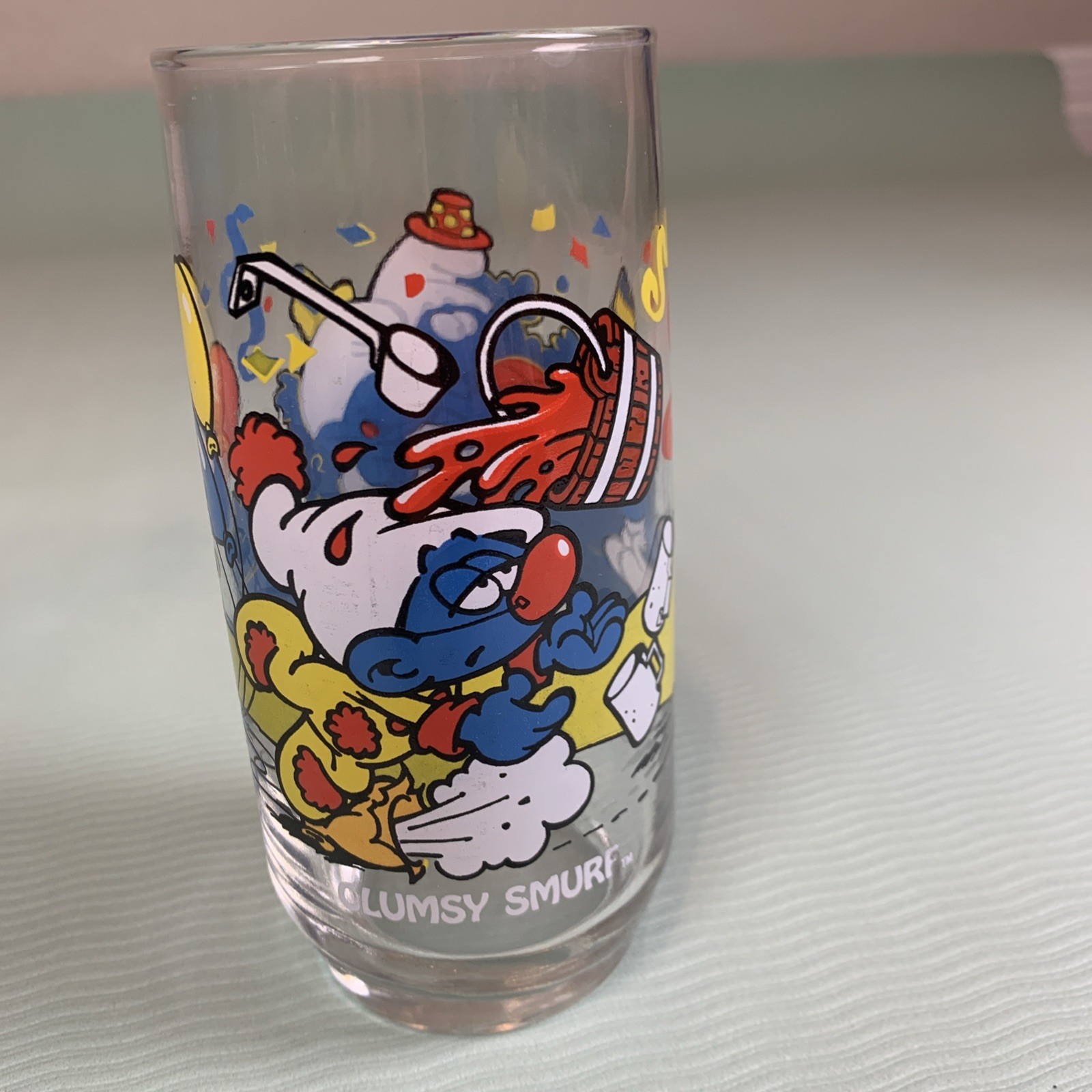 Vintage Clumsy Smurf Drinking Glass 1983 Peyo Wallace Berrie USA Paint Spill Vintage Clumsy Smurf Drinking Glass 1983 Peyo Wallace Berrie USA Paint Spill