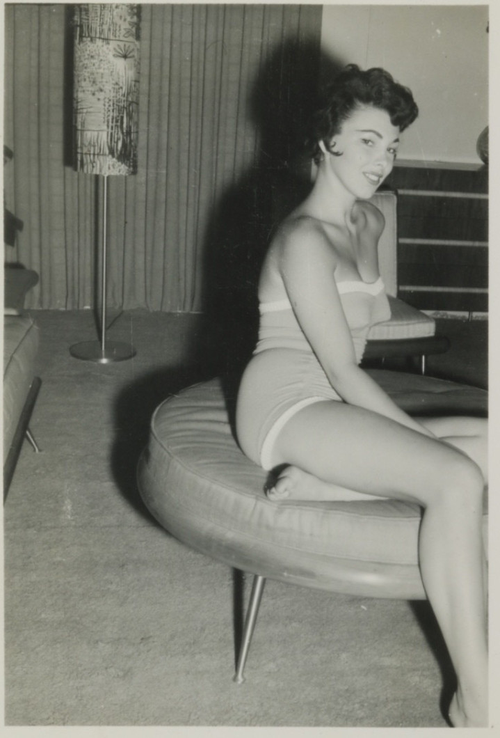 FOUND PHOTO - Gorgeous Woman in swimsuit posing on ottoman mid-century room FOUND PHOTO - Gorgeous Woman in swimsuit posing on ottoman mid-century room