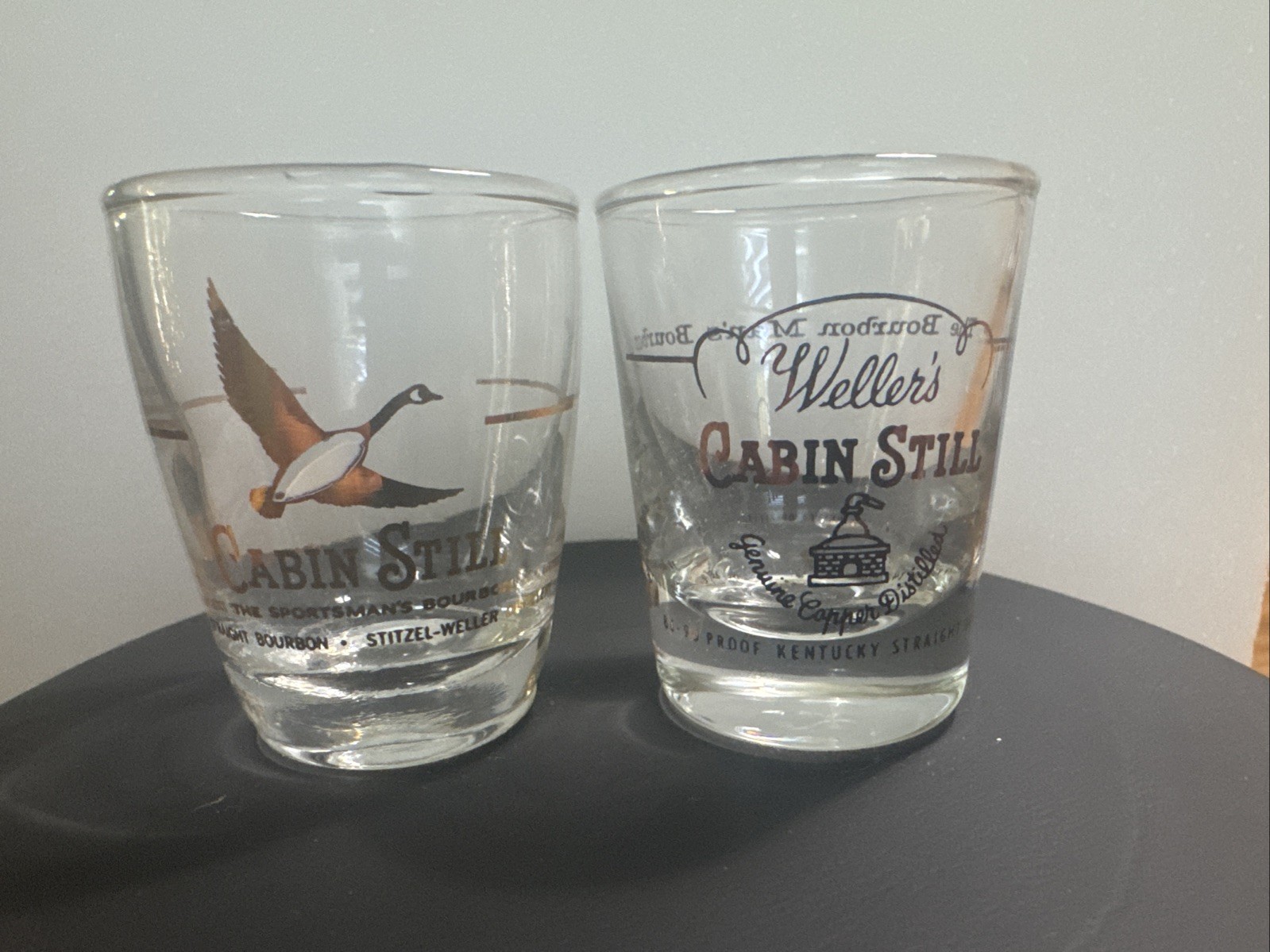 2 - Weller’s Cabin Still Shot Glasses Vintage
