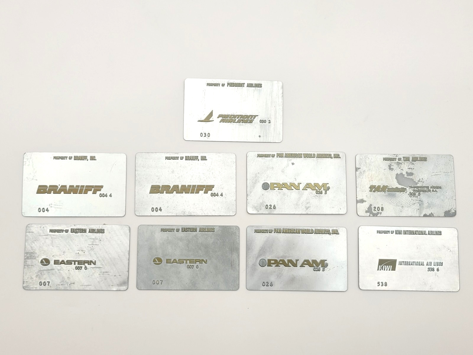 Vintage Metal Airline Ticket Validation Plates Pan Am Eastern Braniff - Lot of 9