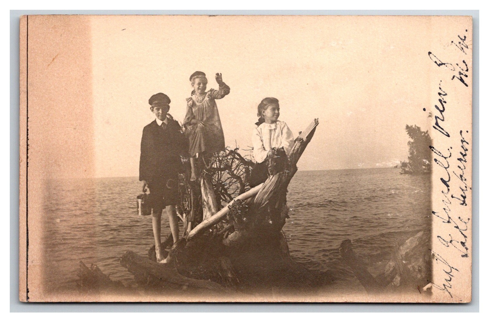 RPPC Lake Superior Children on Driftwood w Toys Ontonagon Michigan.