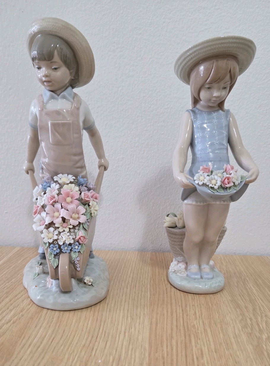 Pair of Lladro figurines Boy With Wheelbarrow Flowers and Skirt Full of Flowers