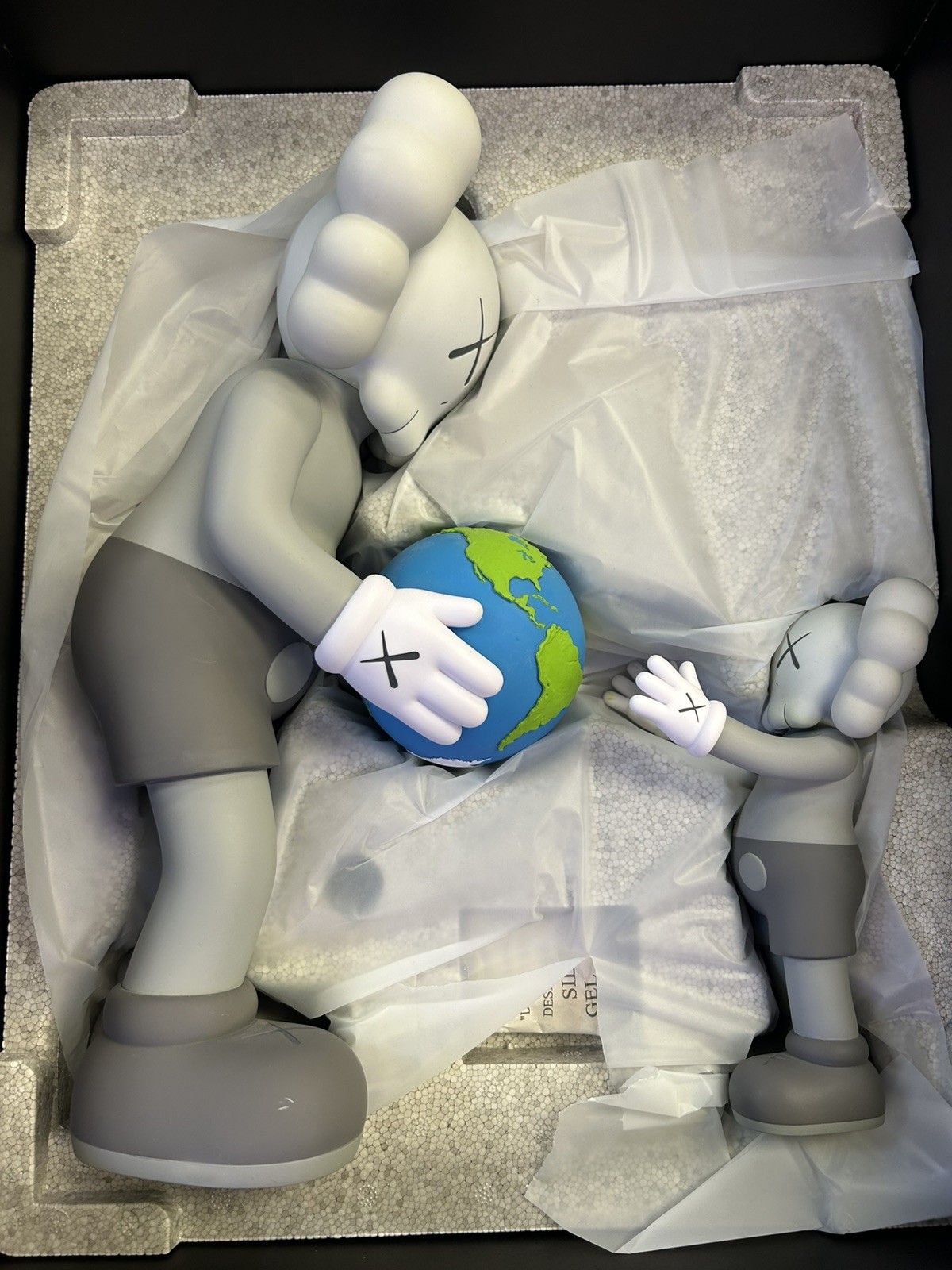KAWS THE PROMISE Open Edition Vinyl Figure with Original Box BROWN. Displayed.