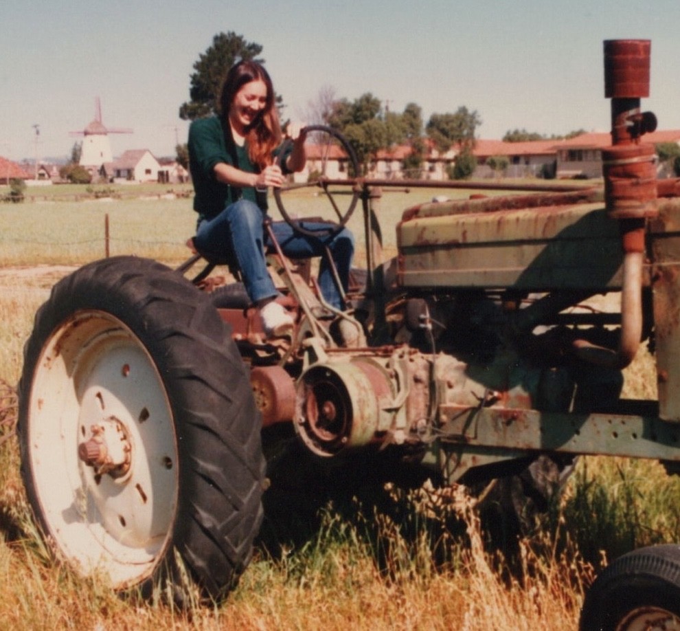 1980s Pretty Woman Driving Old Farm Tractor Rural Field Agriculture