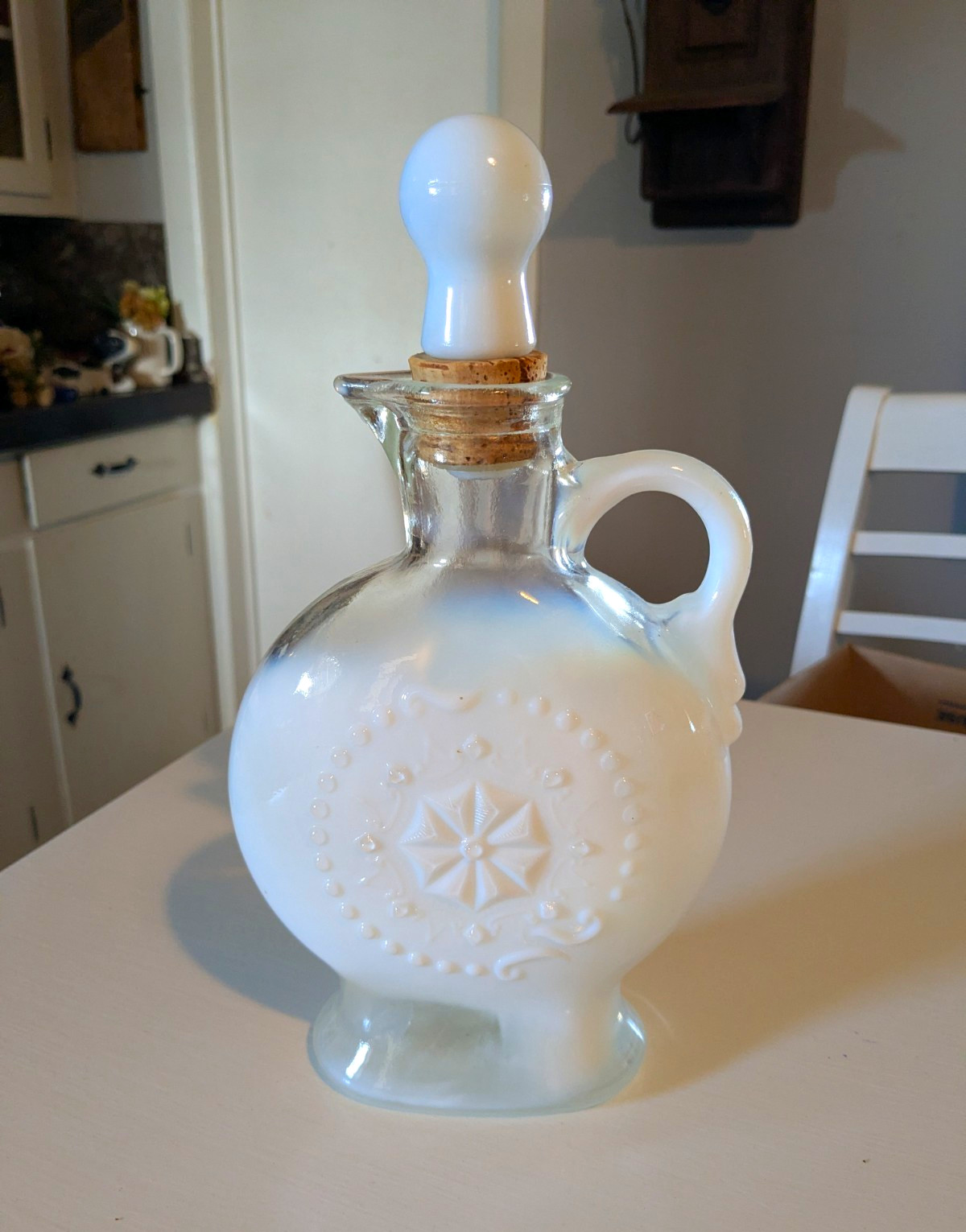 vintage 1957 Jim Beam white opalescent milk glass liquor decanter with an emboss