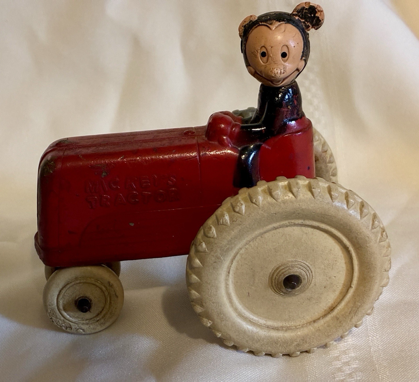 VINTAGE 40-50’S SUN RUBBER MICKEY MOUSE ON RED TRACTOR HEAD TURNS WHEELS ROLL