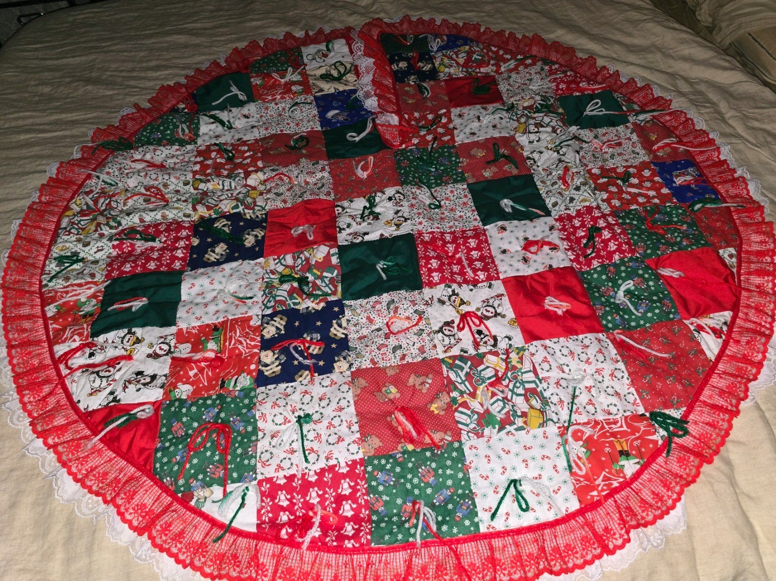 Vintage Handmade Patchwork Quilted Large Christmas Tree Skirt, 48 Inch Round. Vintage Handmade Patchwork Quilted Large Christmas Tree Skirt, 48 Inch Round.
