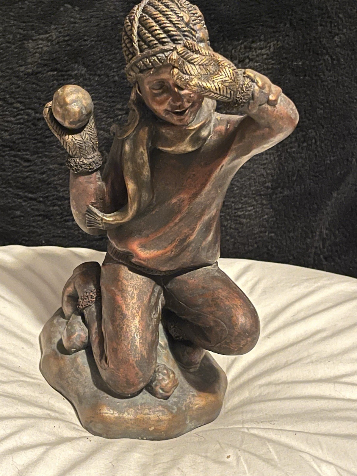 Figurine Of Child Kneeling Throwing A Snowball