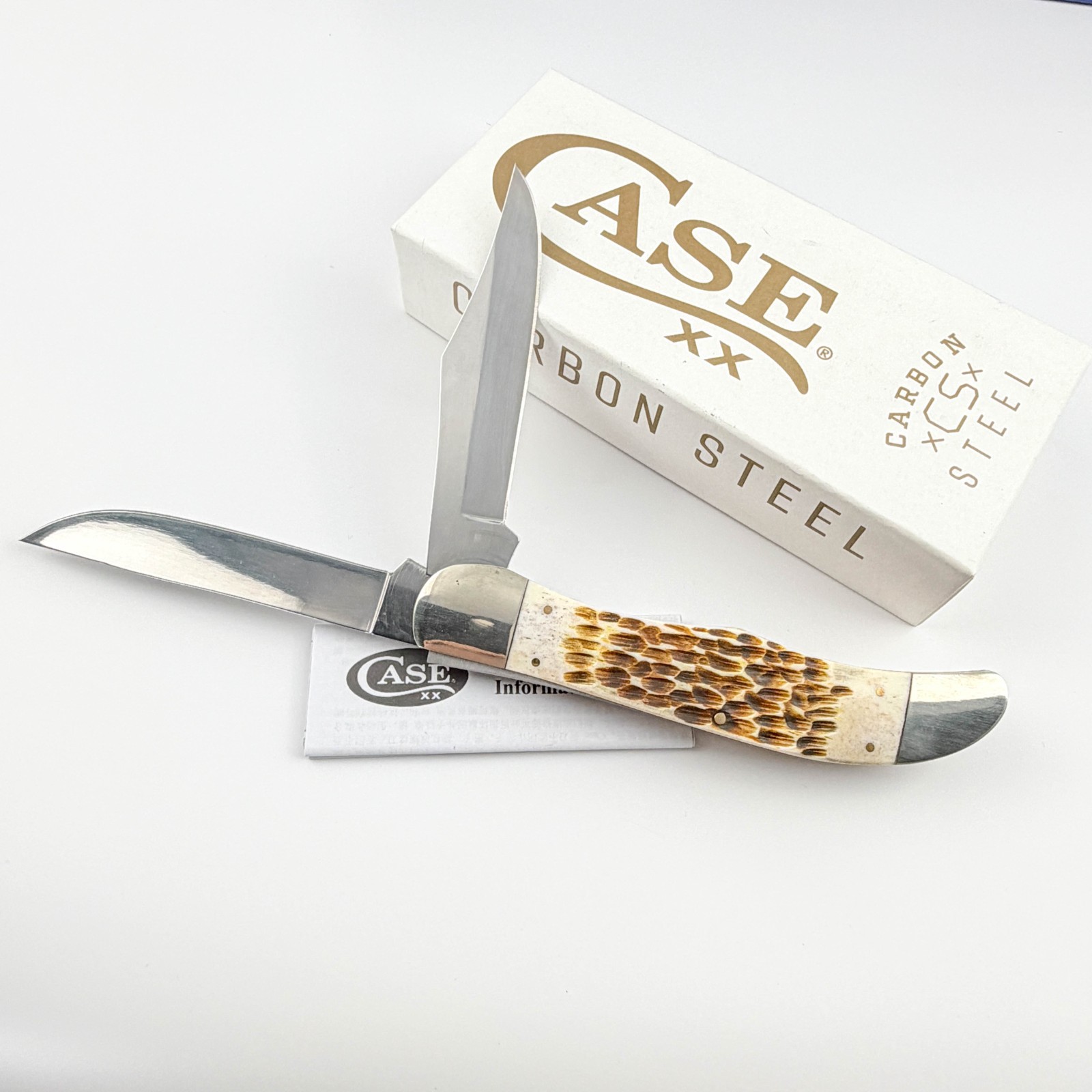 Case xx 30093 Folding Hunter Jigged Amber Bone Carbon Steel Pocket Knife