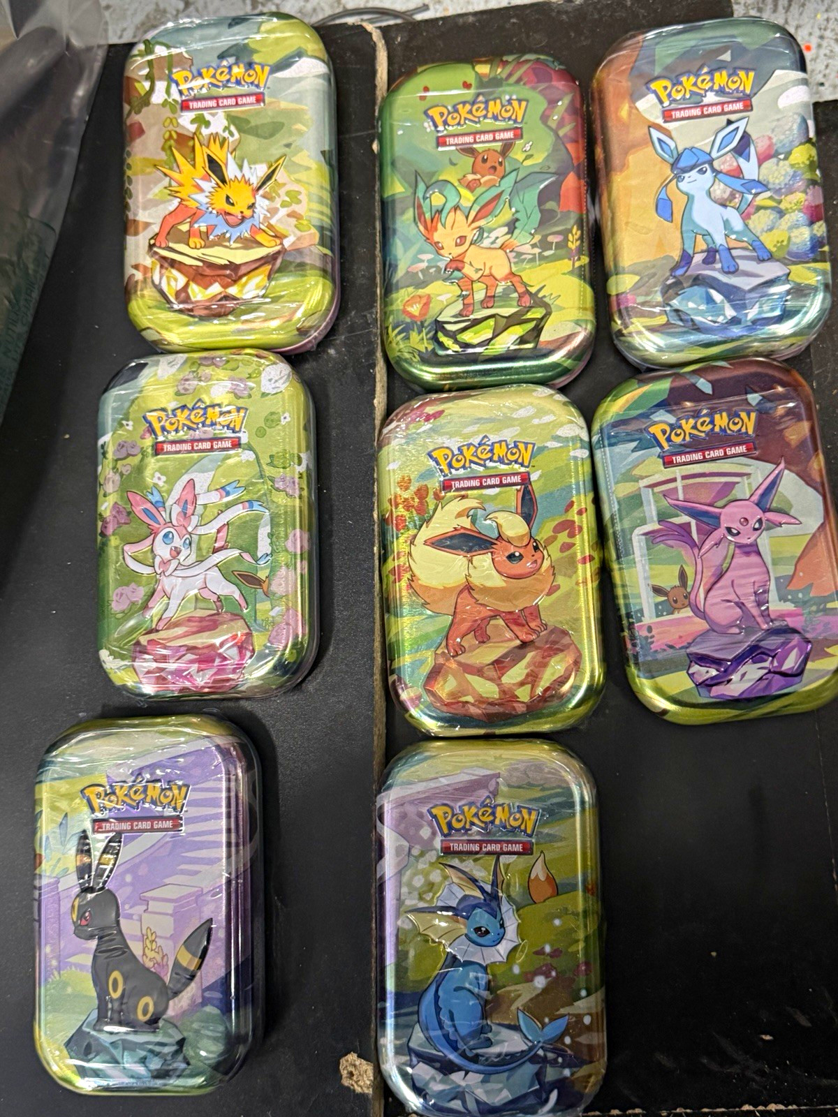 Pokemon Prismatic Evolutions Mini Tin Set of 8 Sealed All Eeveelutions Complete