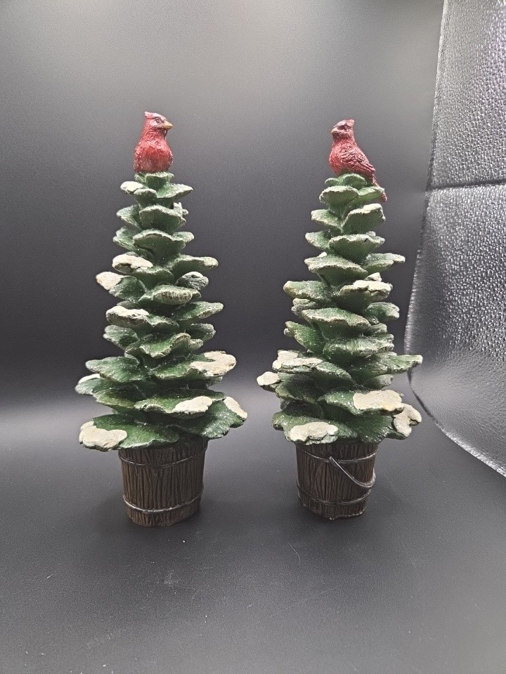 A Pair Of Cardinals Perched On Snow Covered Trees A Pair Of Cardinals Perched On Snow Covered Trees