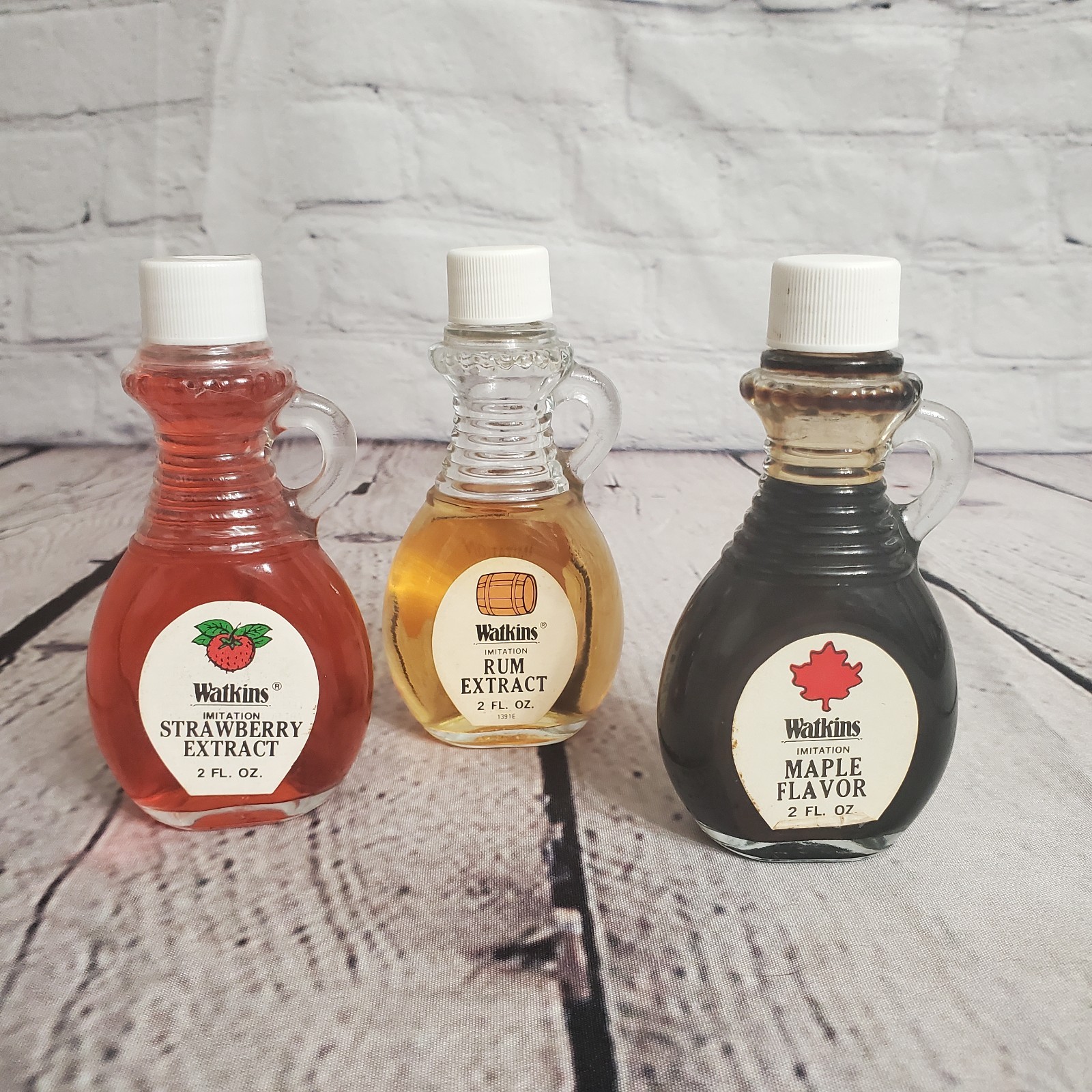 3 BOTTLES OF VINTAGE WATKINS IMITATION EXTRACTS 2oz WITH SIDE HANDLE 3 BOTTLES OF VINTAGE WATKINS IMITATION EXTRACTS 2oz WITH SIDE HANDLE