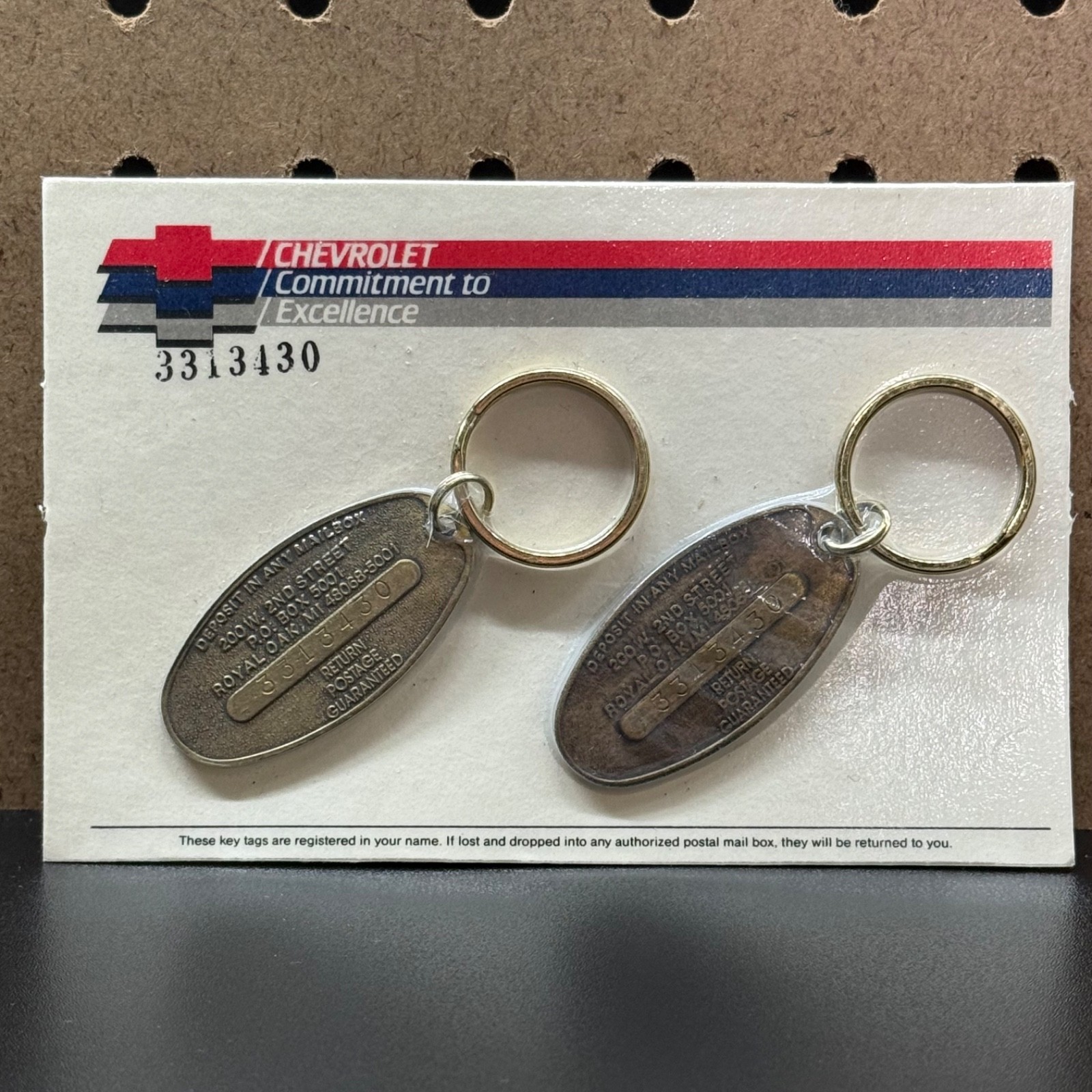 Chevrolet Commitment To Excellence 3313430 2 Keychains new in package Brass