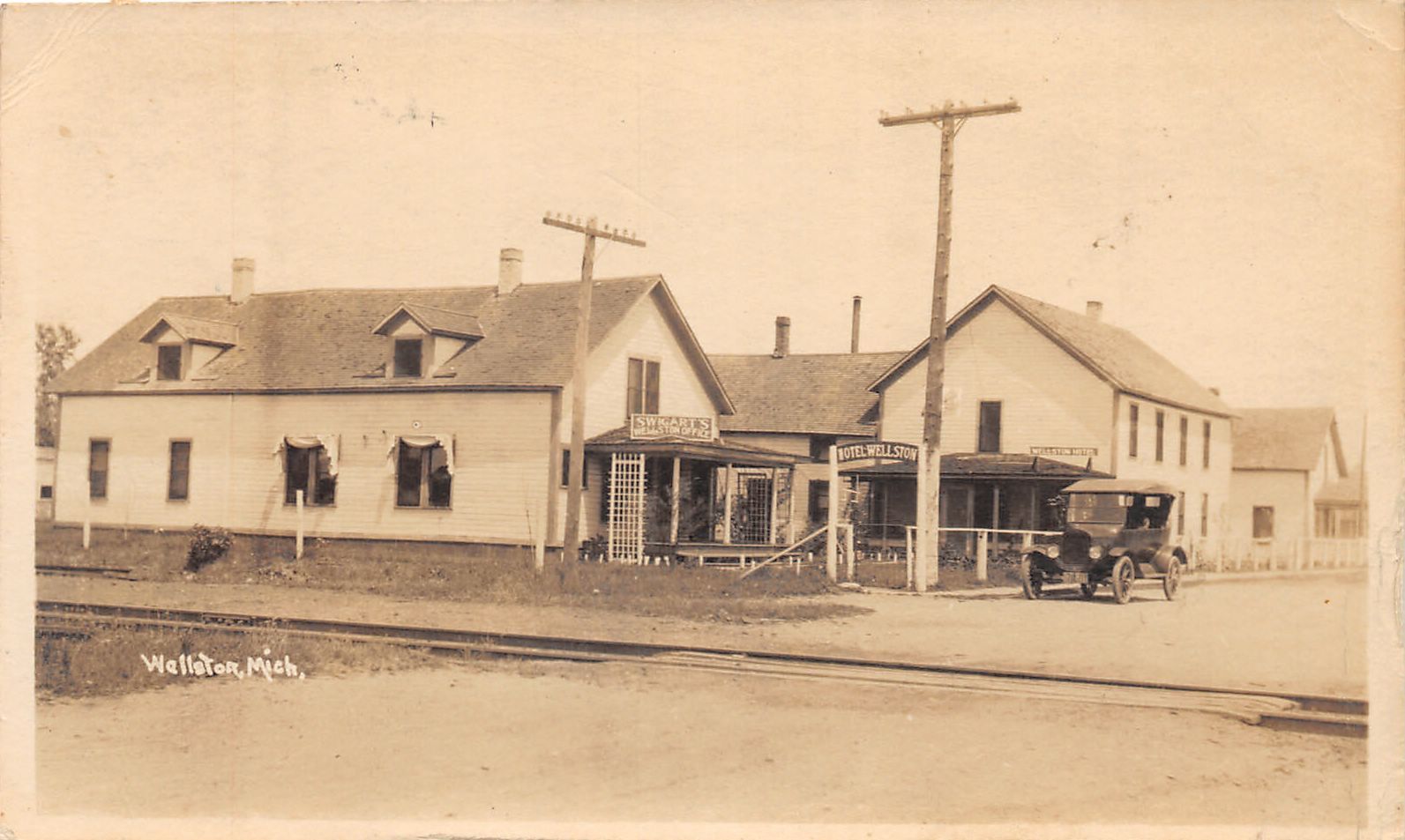 J38/ Wellston Michigan RPPC Postcard c1920s Swigart\'s Store Automobile 216