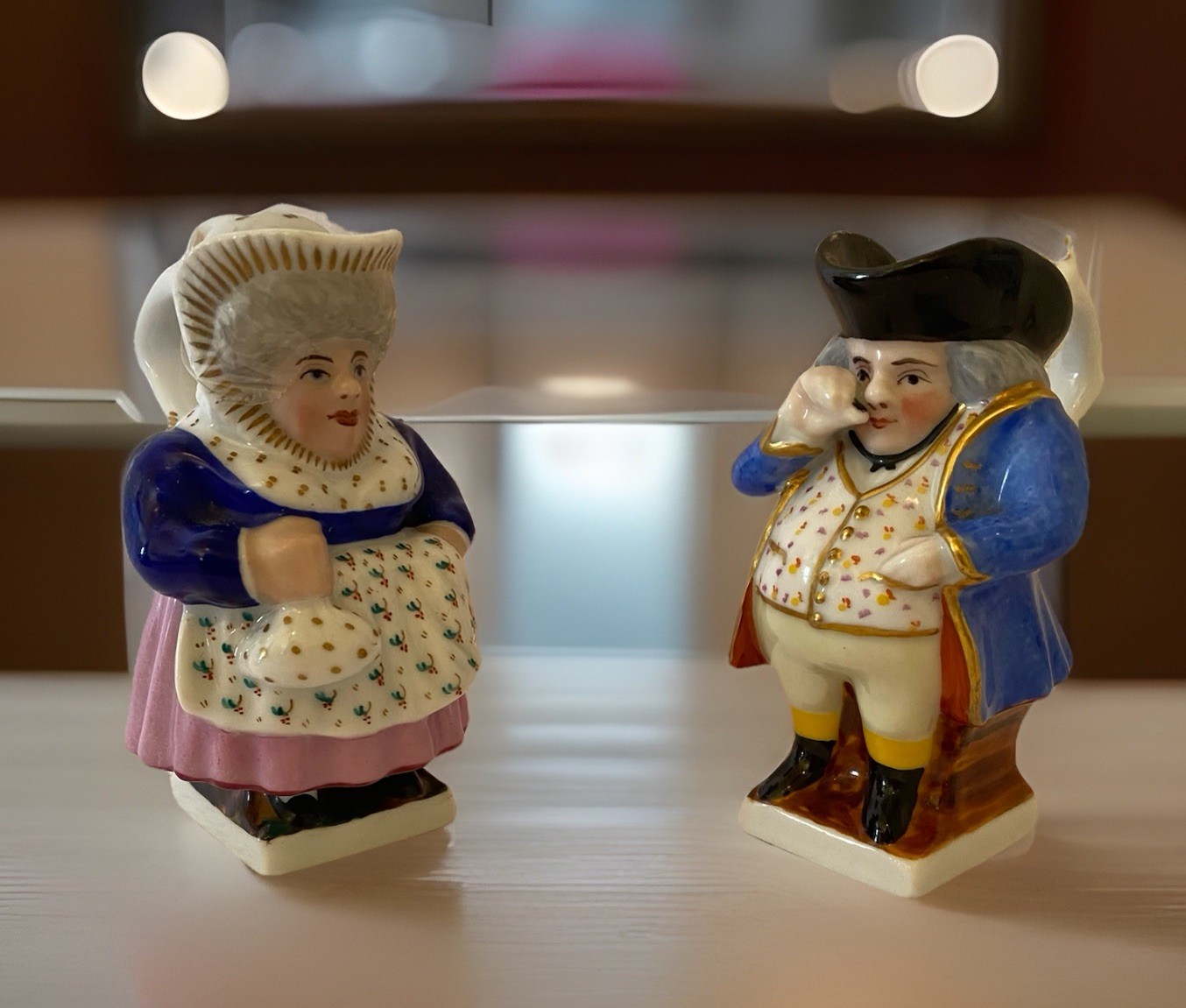 Porcelain Polychrome Figual Toby Jugs Depicting In Traditional Dress