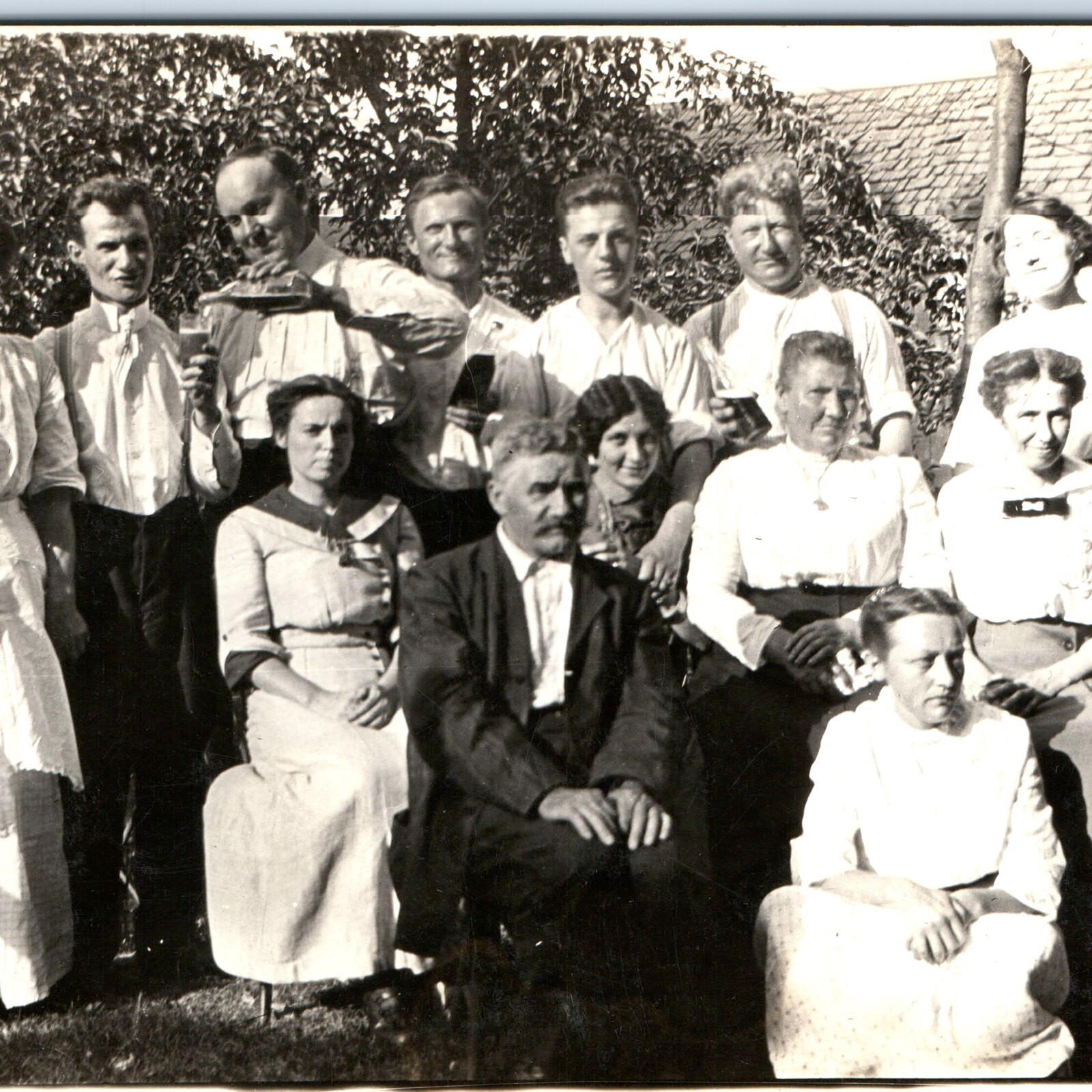 c1910s Outdoor Family Gathering RPPC Pouring Beer Bottle Michigan Runghals Photo c1910s Outdoor Family Gathering RPPC Pouring Beer Bottle Michigan Runghals Photo
