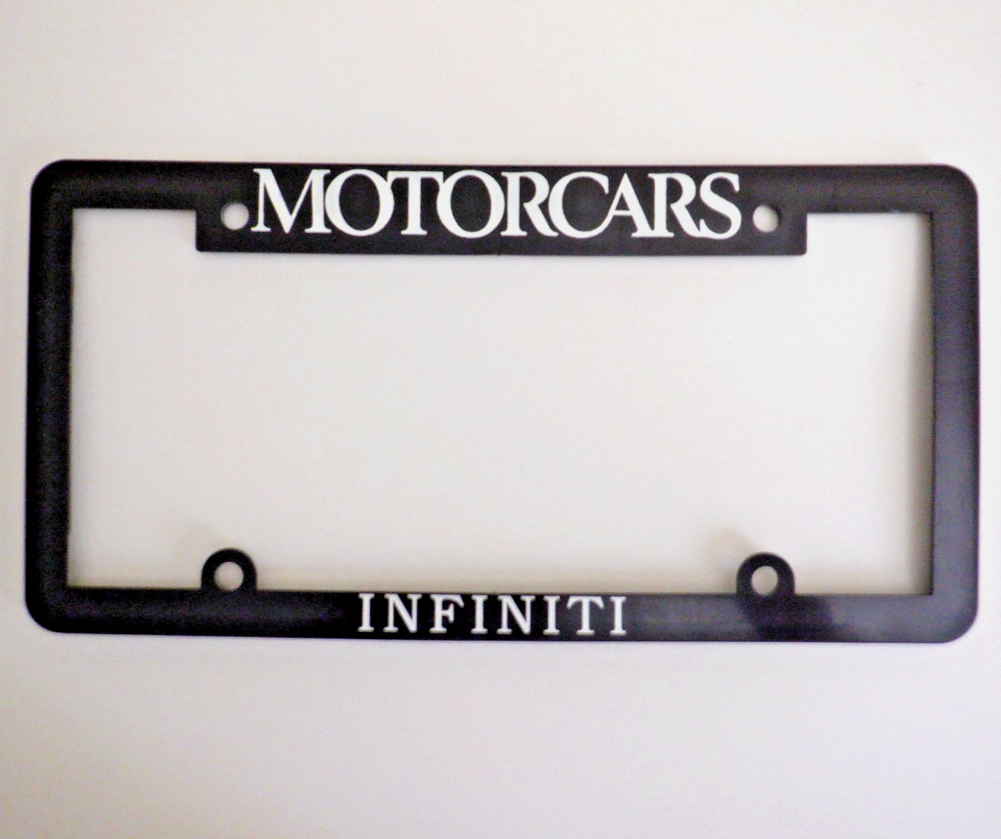 NOS 1990s Motorcars INFINITI BEDFORD OH Dealer LICENSE PLATE FRAME Nissan Datsun