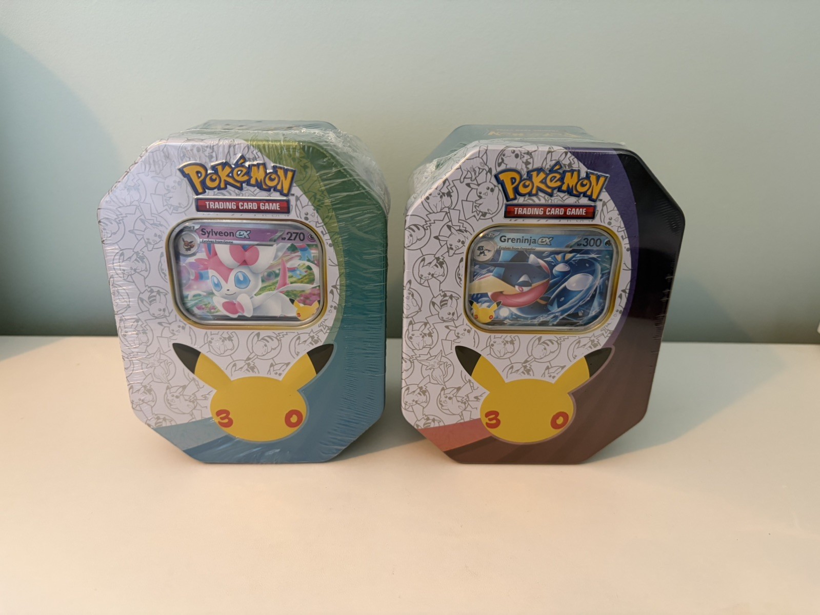 Pokemon 30th Anniversary Tins - Greninja & Sylveon - Seal rip - read description