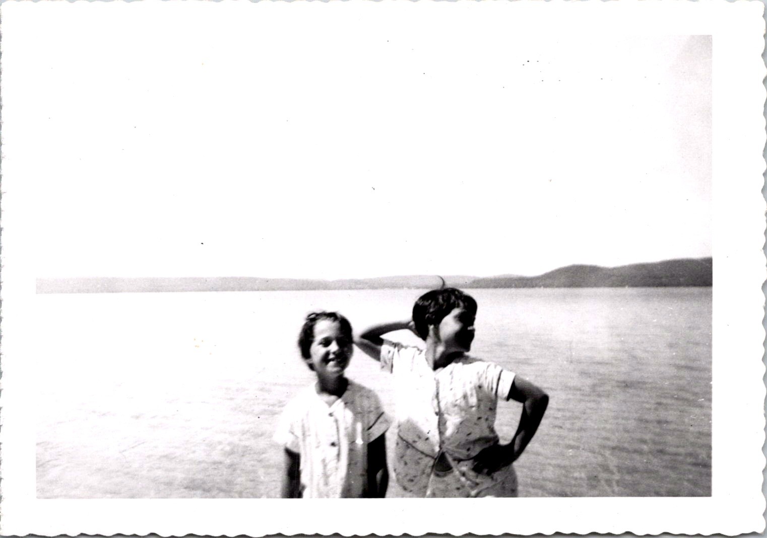 Playful Young Girls Wading in Sunny Lake, 1950s Vintage Snapshot Photo