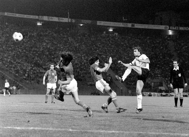 The German striker Dieter Muller volleys front CSSR defenders Anton- Old Photo