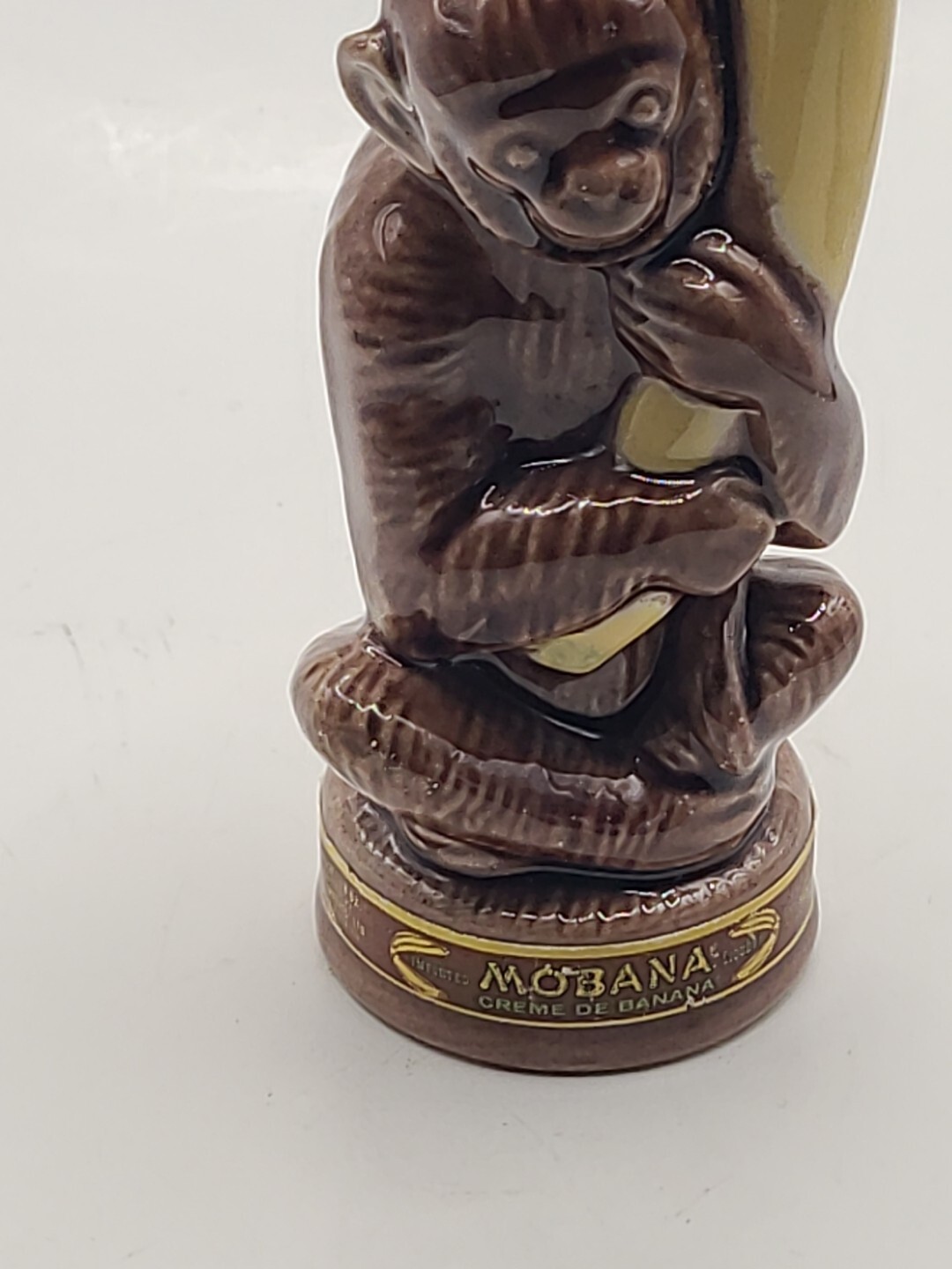 Barware Mobana Creme De Banana ceramic monkey holding banana. 4 H. Vintage Barware Mobana Creme De Banana ceramic monkey holding banana. 4 H. Vintage