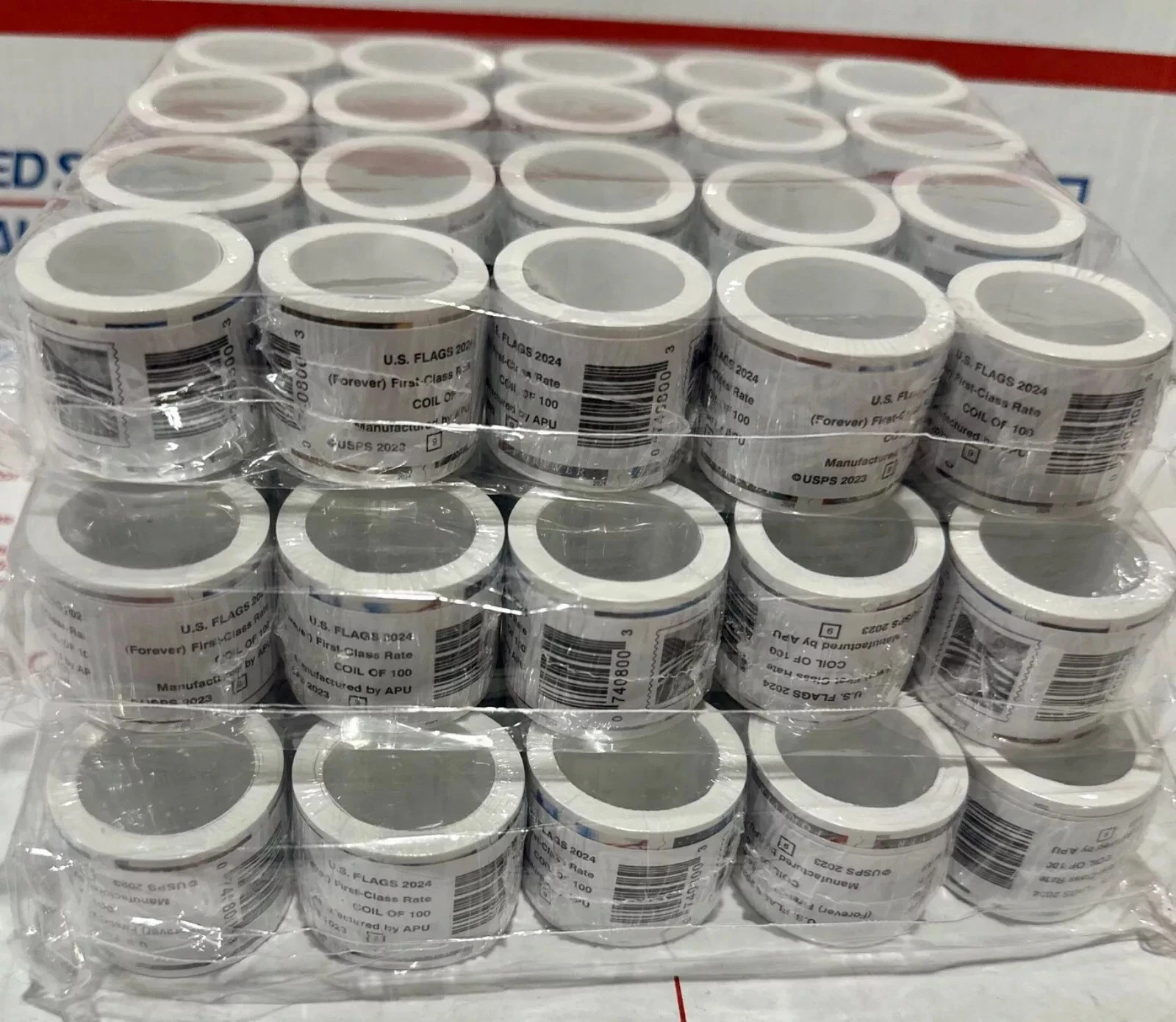 5 rolls of 100 USPS postage stamps, totaling 500 pieces