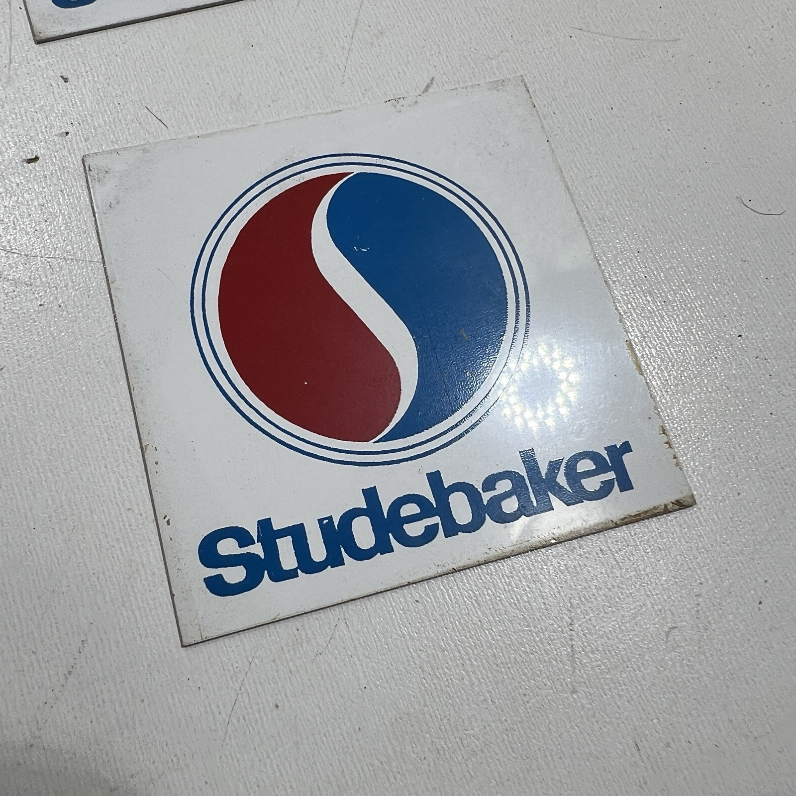 Authorized Studebaker dealer handout  propaganda 2 inch square aluminum tag