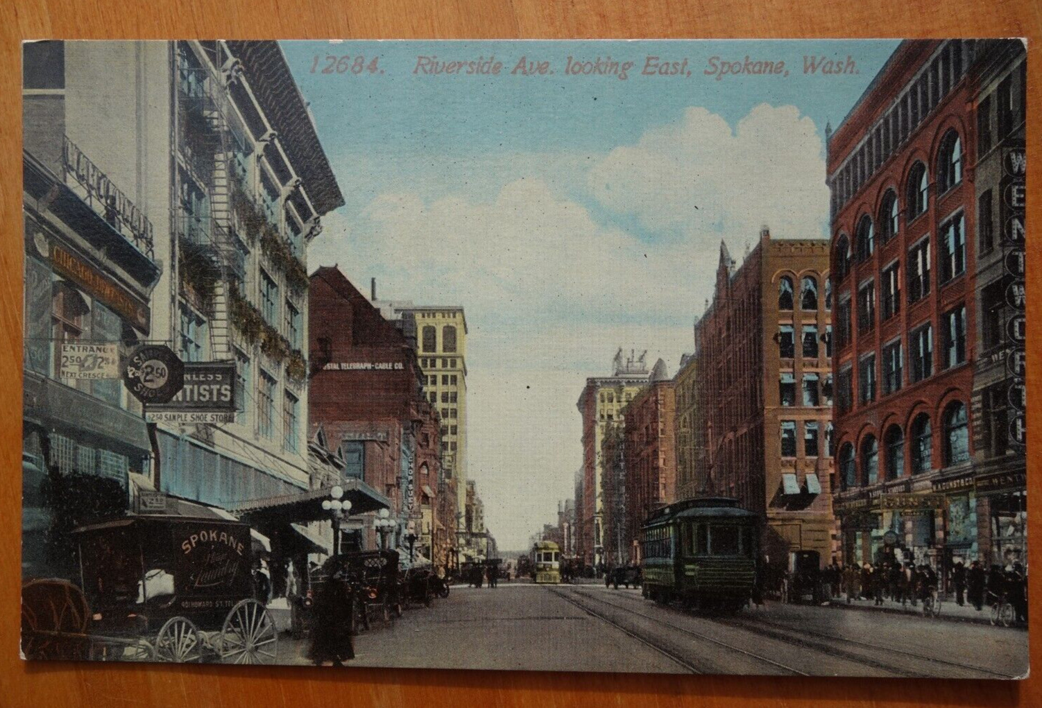 Riverside Ave., looking East, Spokane WASH WA postcard laundry wagon, trolley Riverside Ave., looking East, Spokane WASH WA postcard laundry wagon, trolley