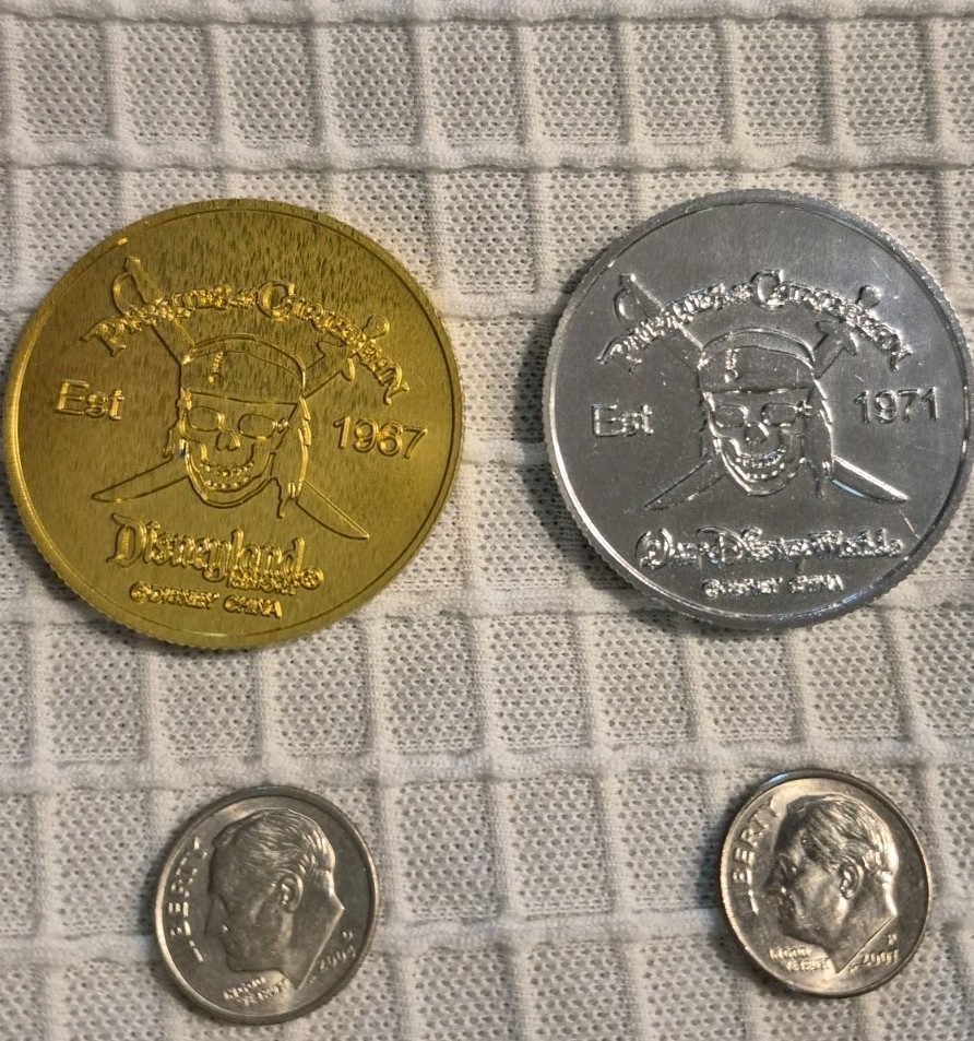 Disney PIRATES OF THE CARIBBEAN token Coin. SET OF TWO SILVER + GOLD 1967-1971 